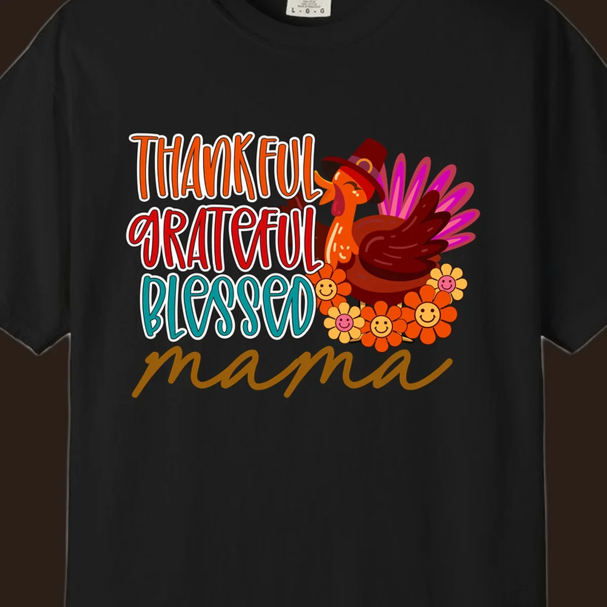 Thanksgiving mama turkey floral design with smiling flowers and colorful text.