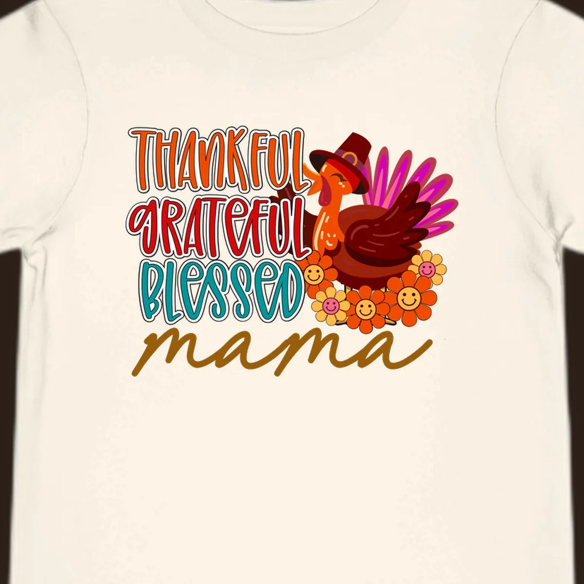 Thanksgiving mama turkey floral design with smiling flowers and colorful text.