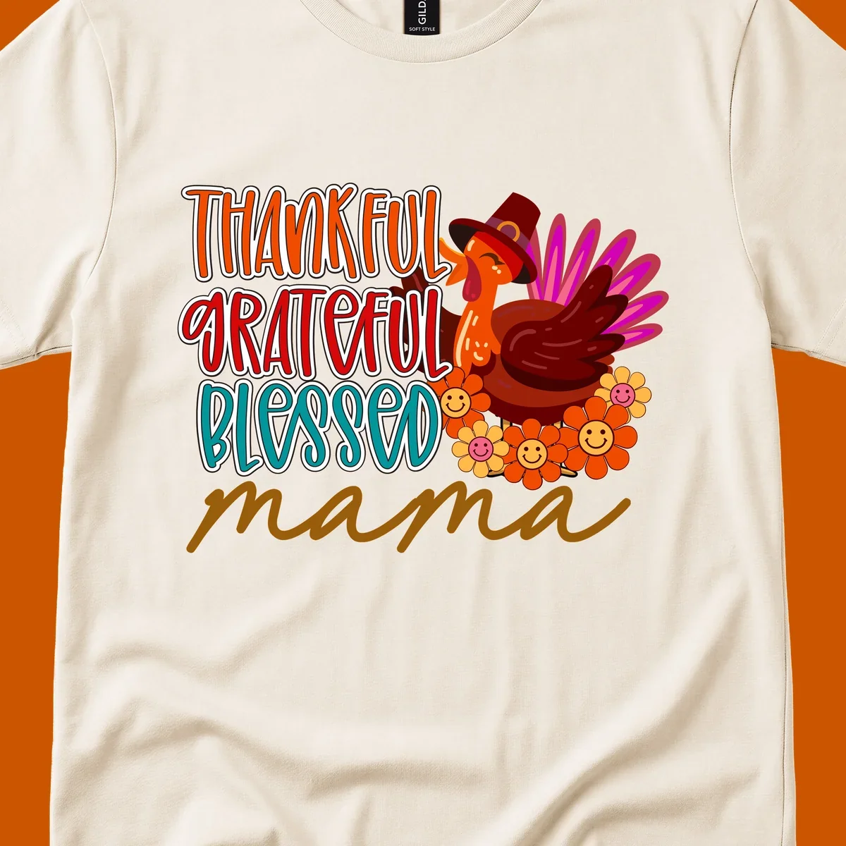 Thanksgiving mama turkey floral design with smiling flowers and colorful text.
