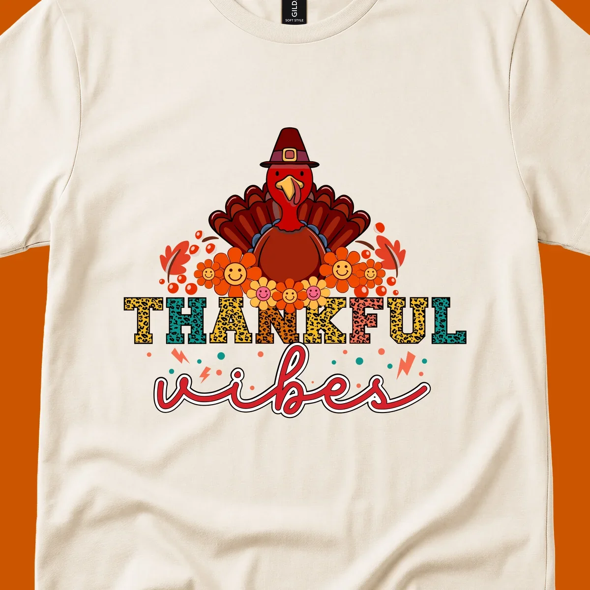 Retro Thanksgiving thankful vibes design with a turkey, flowers, and leopard print text.