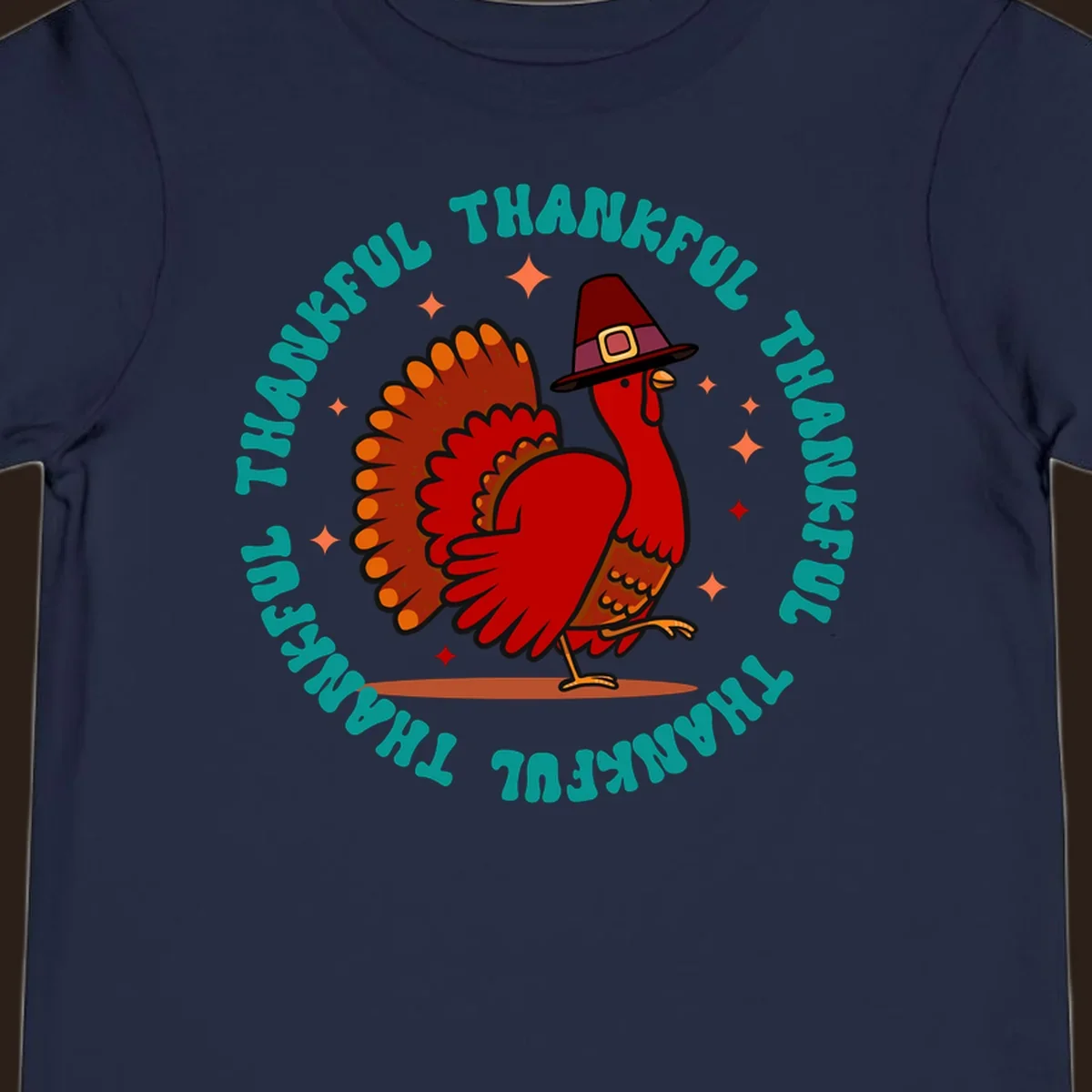 Thanksgiving turkey wearing a pilgrim hat with 'THANKFUL' text and starbursts.