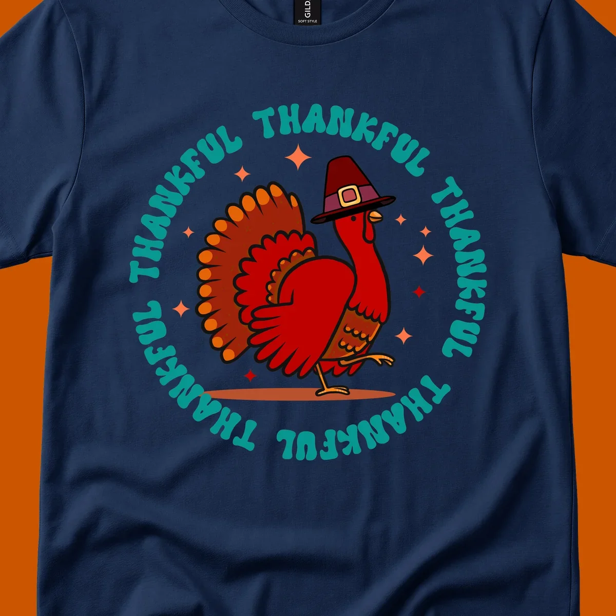 Thanksgiving turkey wearing a pilgrim hat with 'THANKFUL' text and starbursts.