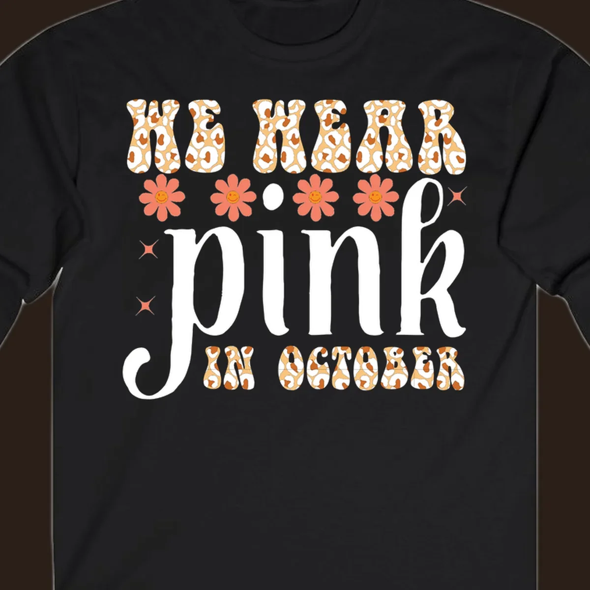 Retro "WE WEAR pink IN OCTOBER" design with leopard print and smiling flowers.