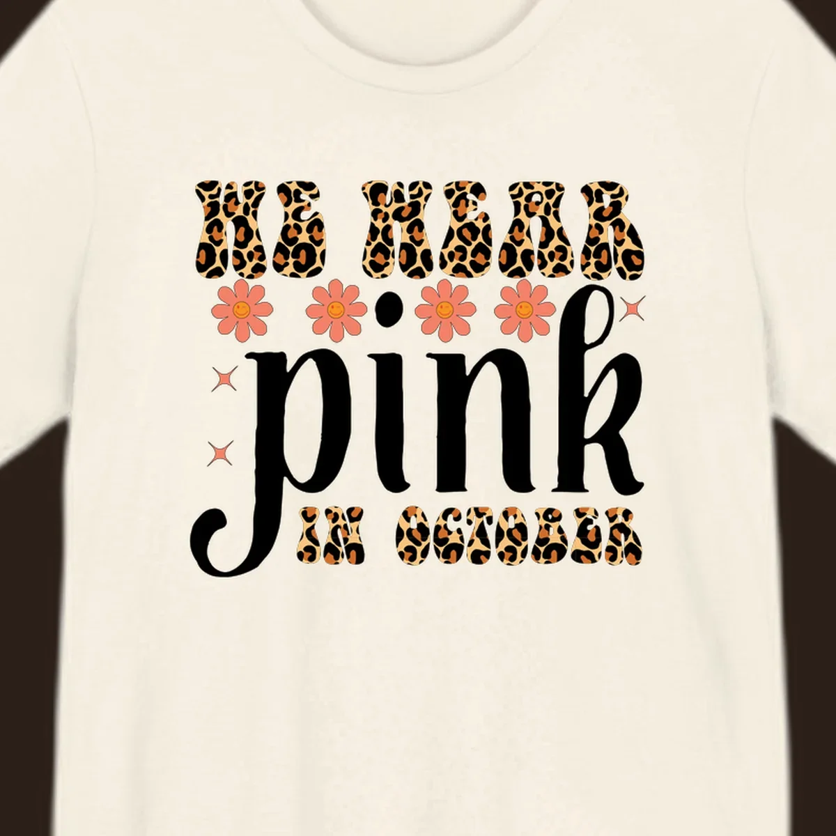 Retro "WE WEAR pink IN OCTOBER" design with leopard print and smiling flowers.