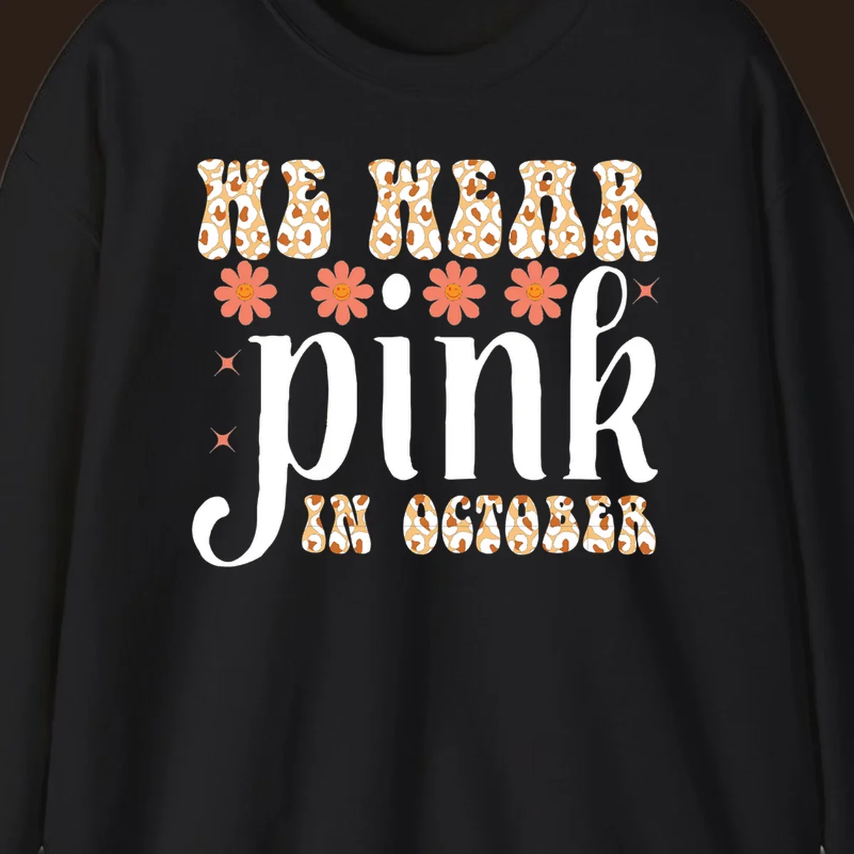 Retro "WE WEAR pink IN OCTOBER" design with leopard print and smiling flowers.