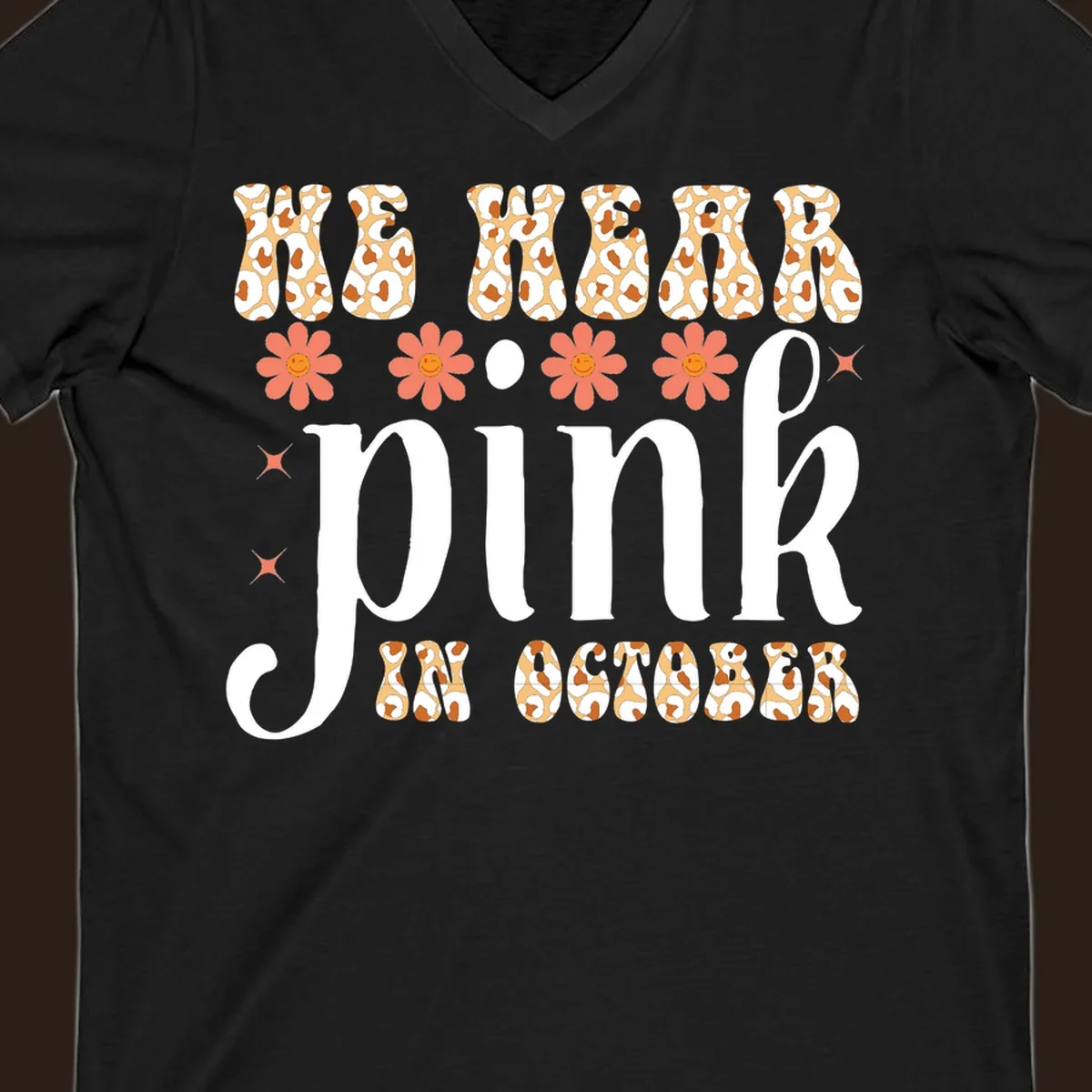 Retro "WE WEAR pink IN OCTOBER" design with leopard print and smiling flowers.