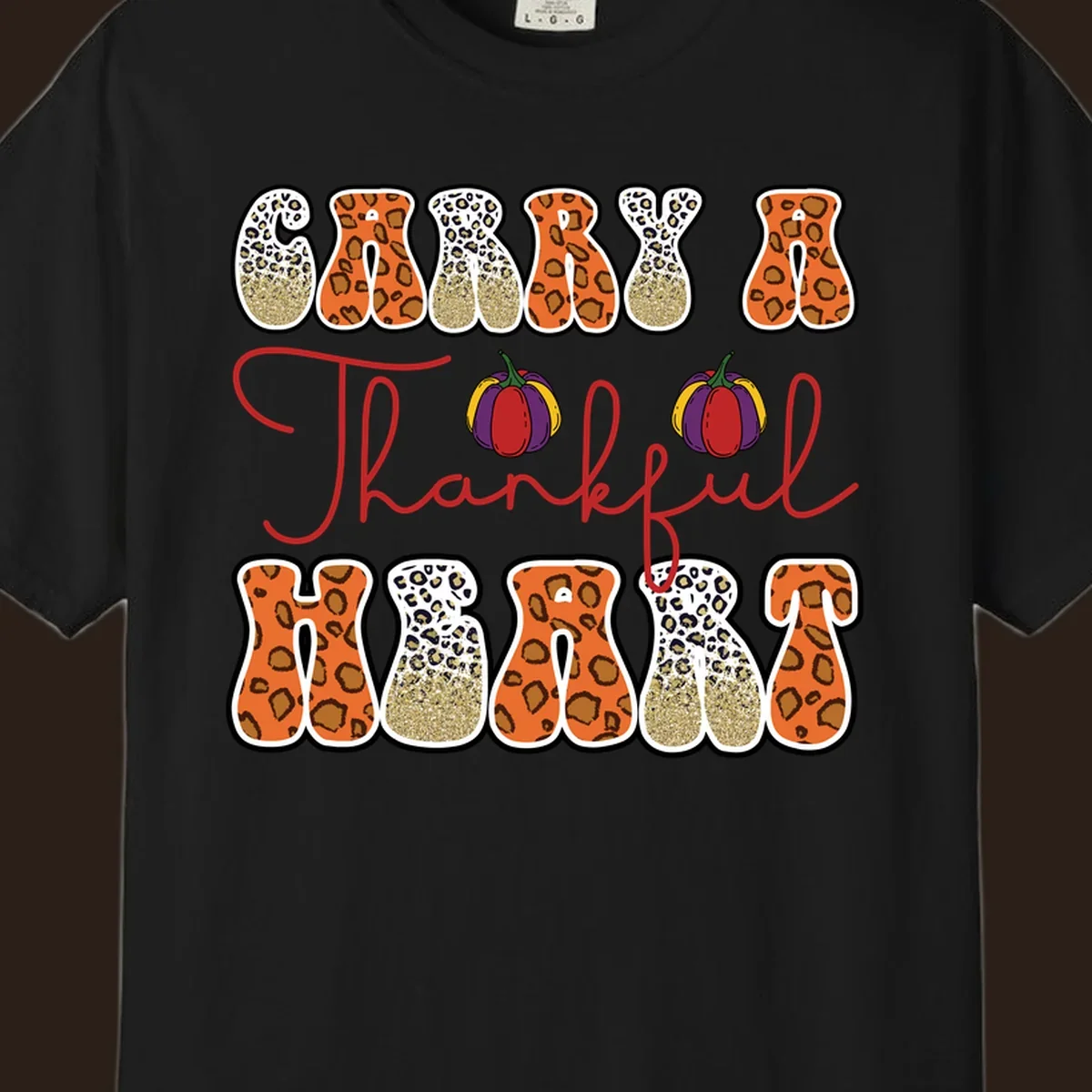 Carry A Thankful Heart design with leopard print letters and pumpkins.