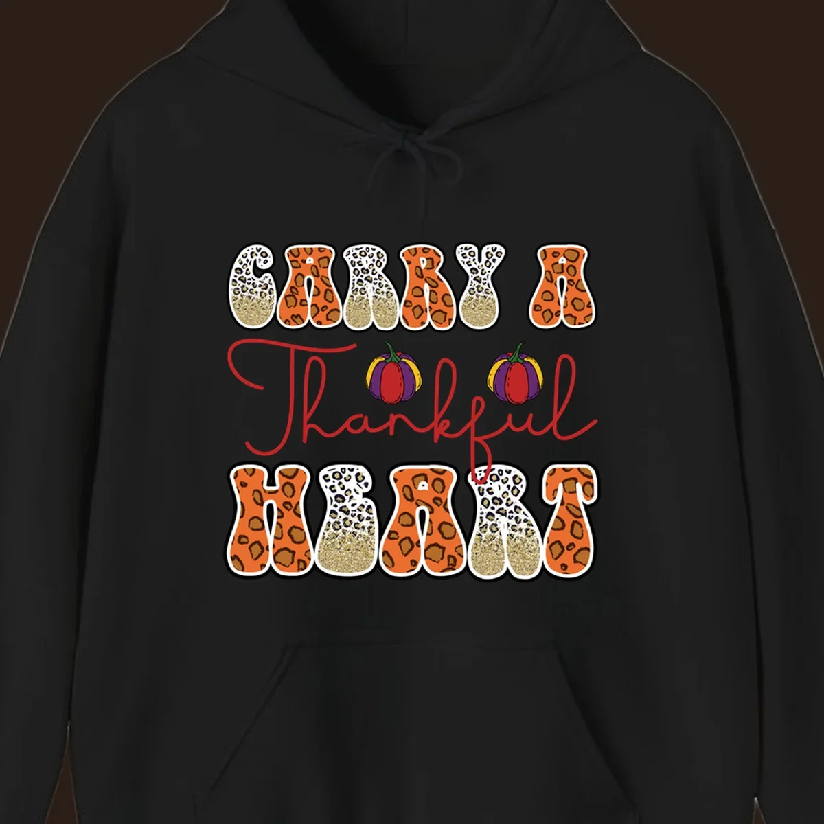 Carry A Thankful Heart design with leopard print letters and pumpkins.