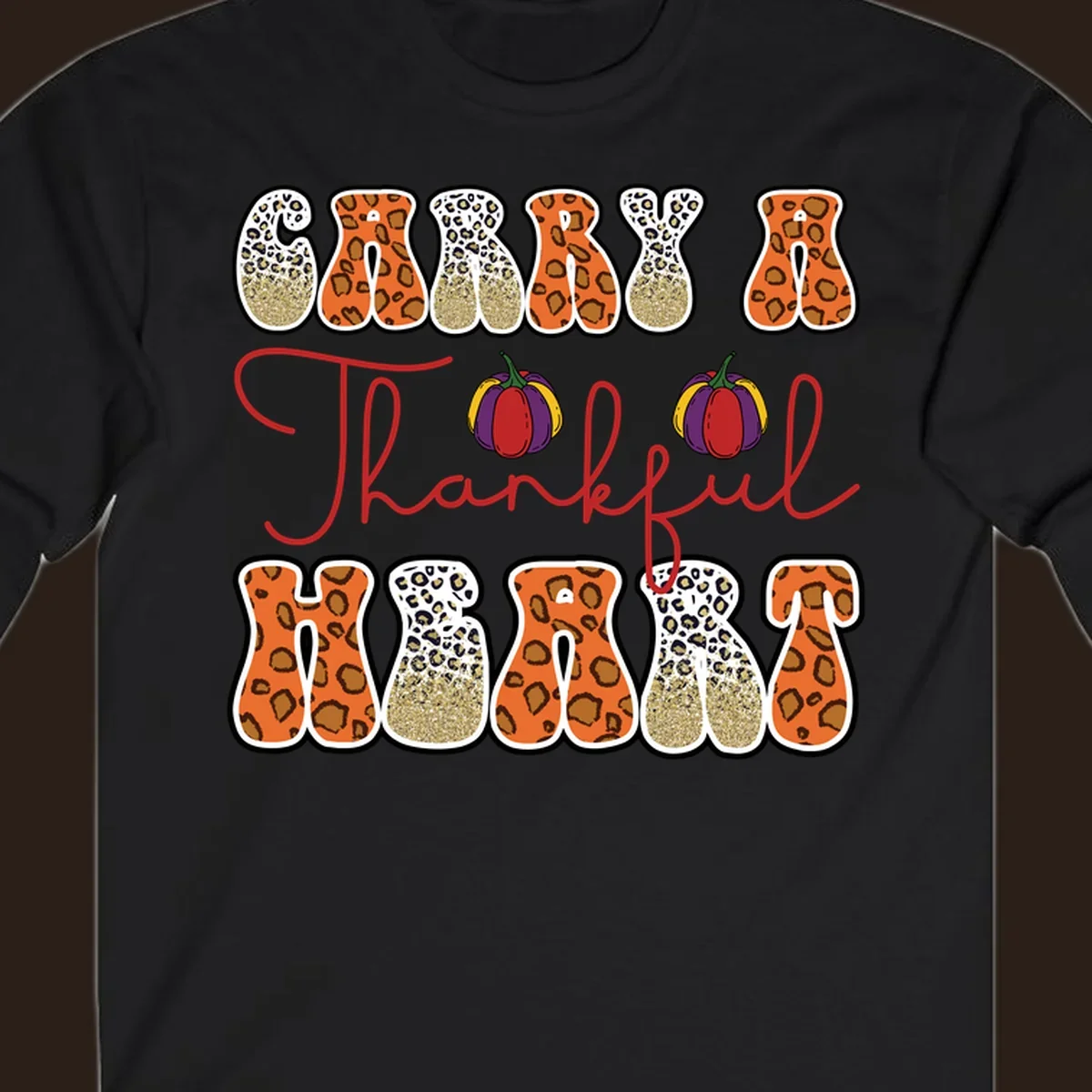 Carry A Thankful Heart design with leopard print letters and pumpkins.