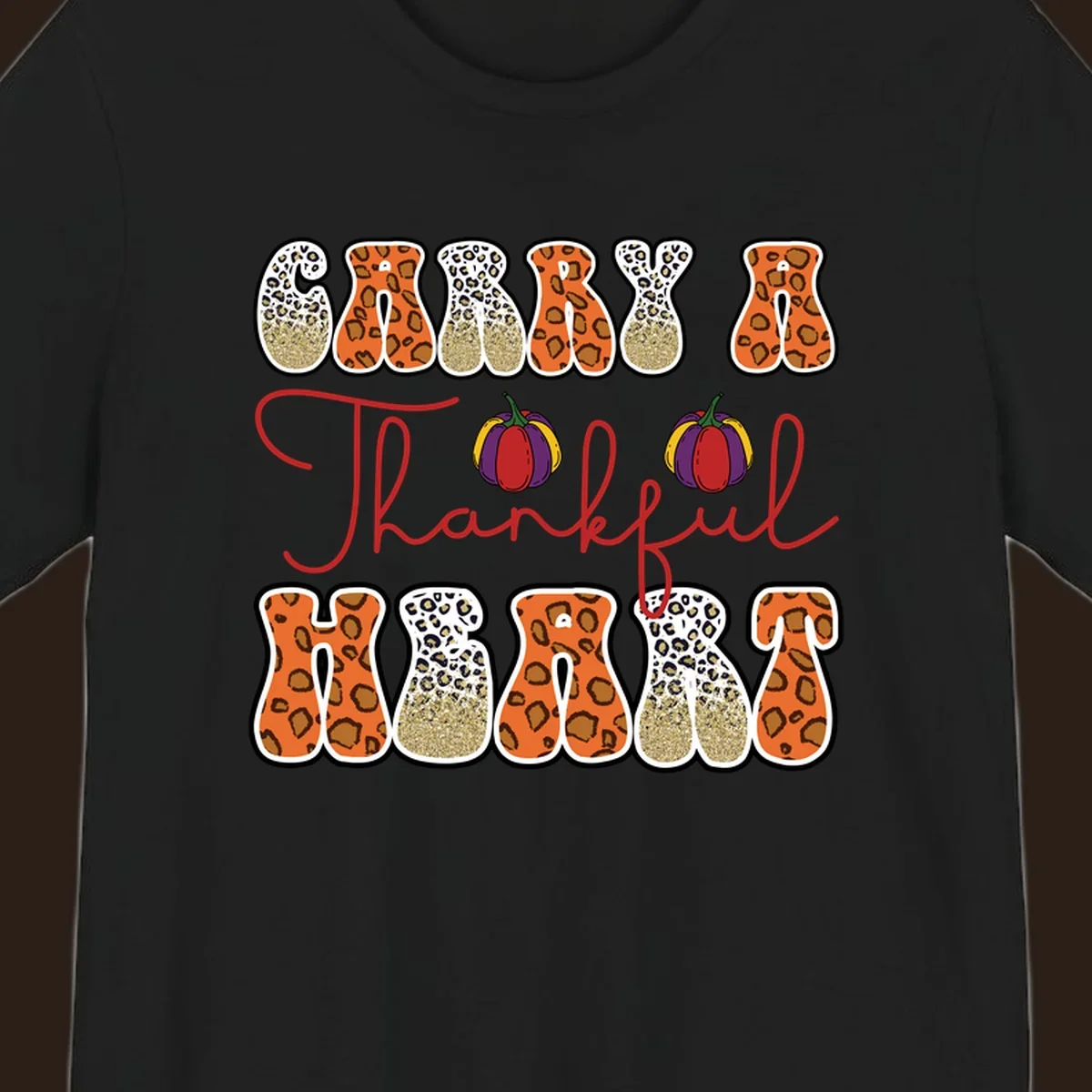 Carry A Thankful Heart design with leopard print letters and pumpkins.
