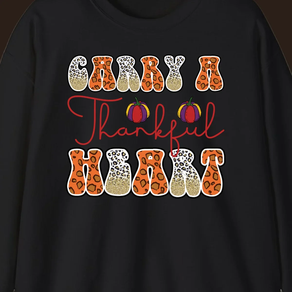 Carry A Thankful Heart design with leopard print letters and pumpkins.