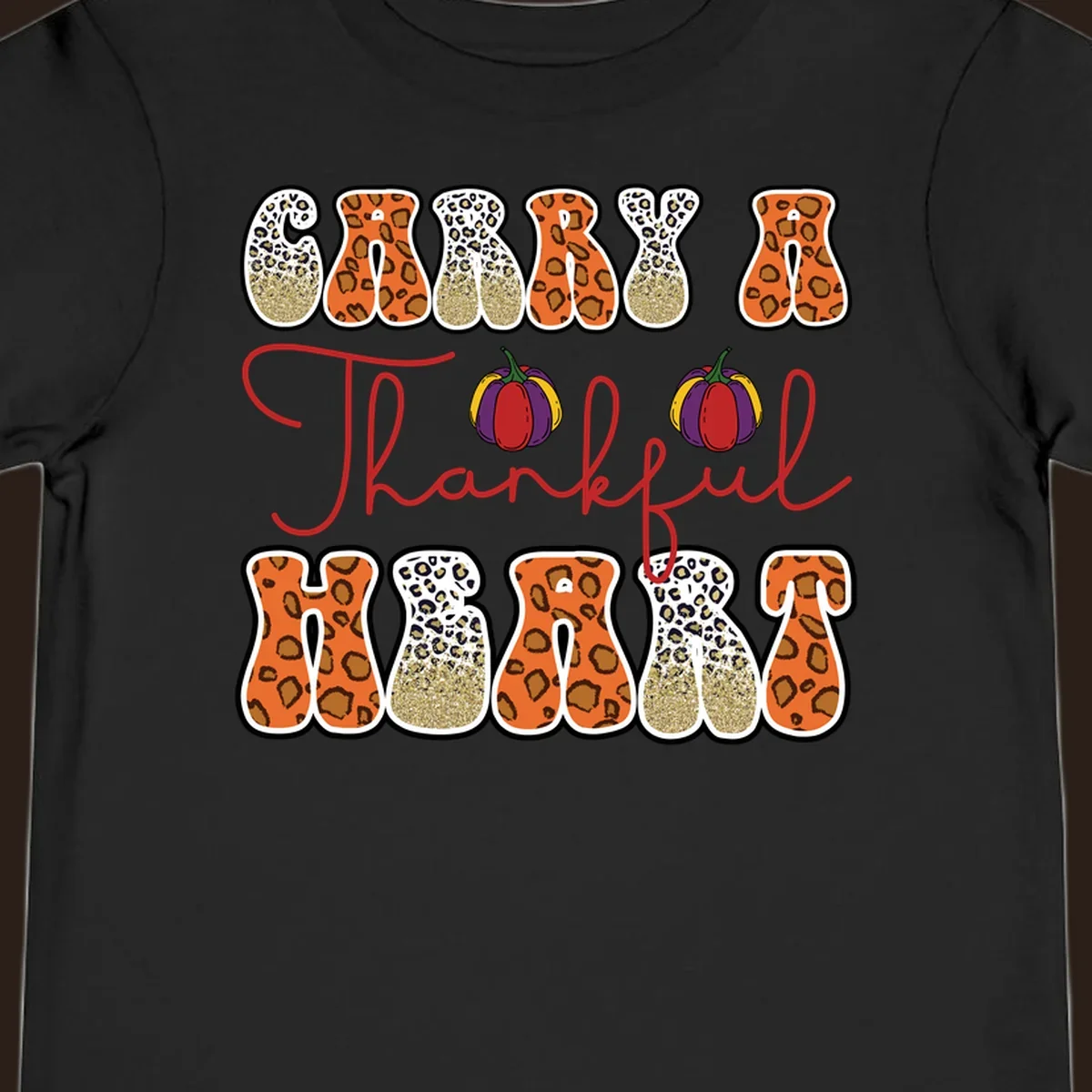 Carry A Thankful Heart design with leopard print letters and pumpkins.