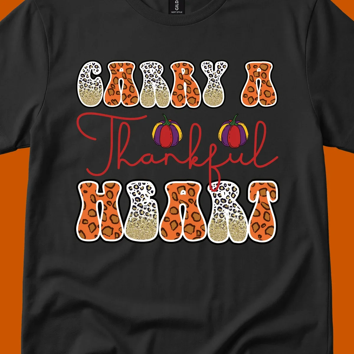 Carry A Thankful Heart design with leopard print letters and pumpkins.