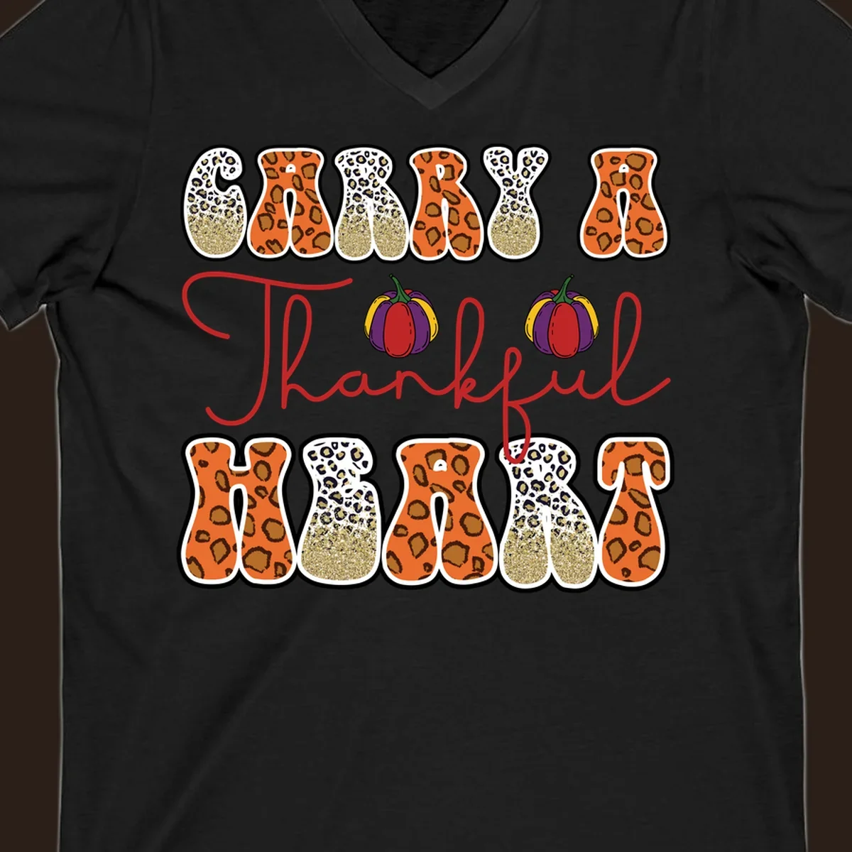 Carry A Thankful Heart design with leopard print letters and pumpkins.
