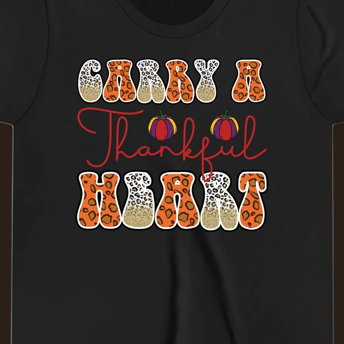 Carry A Thankful Heart design with leopard print letters and pumpkins.