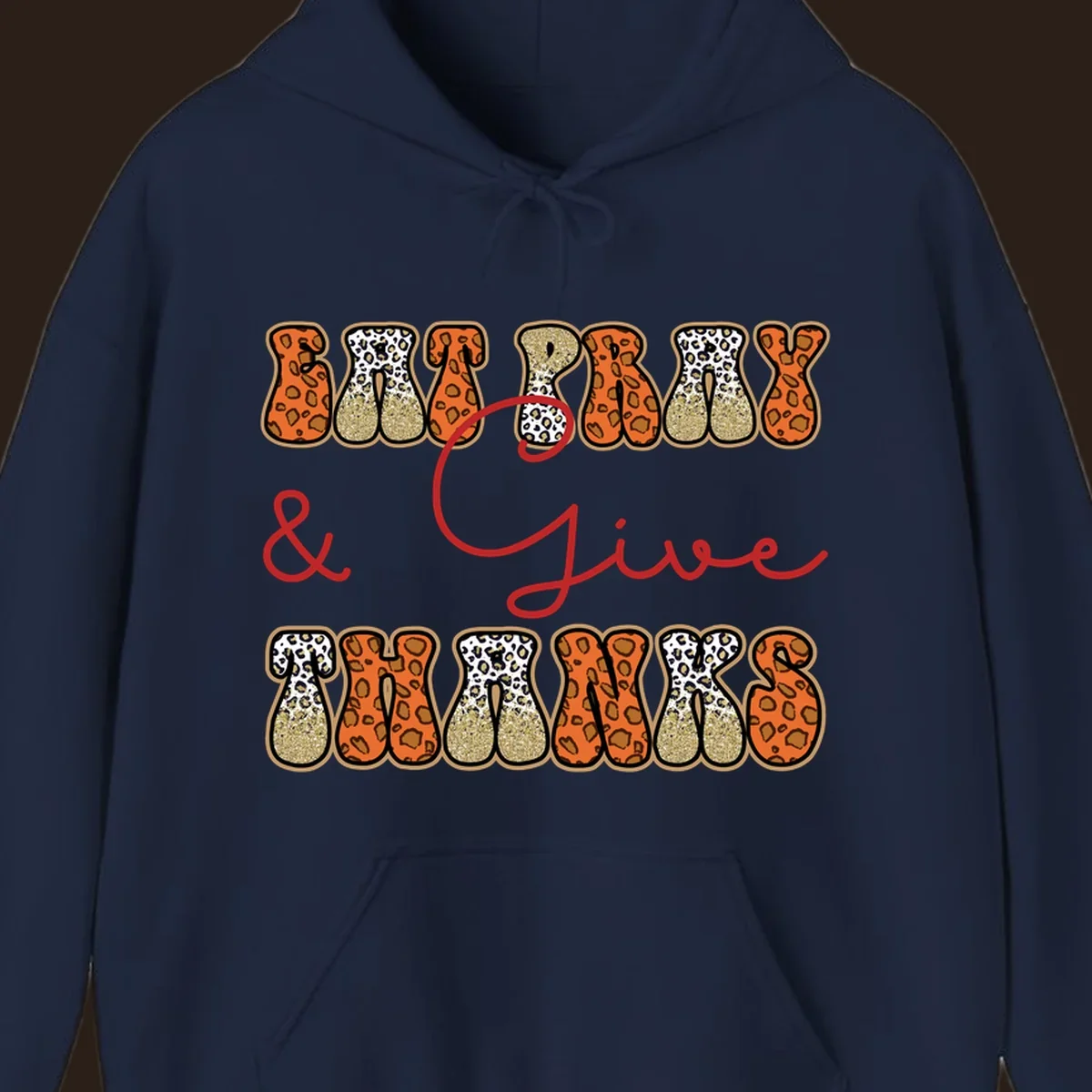 Eat Pray Give Thanks leopard print text design with gold glitter accents.