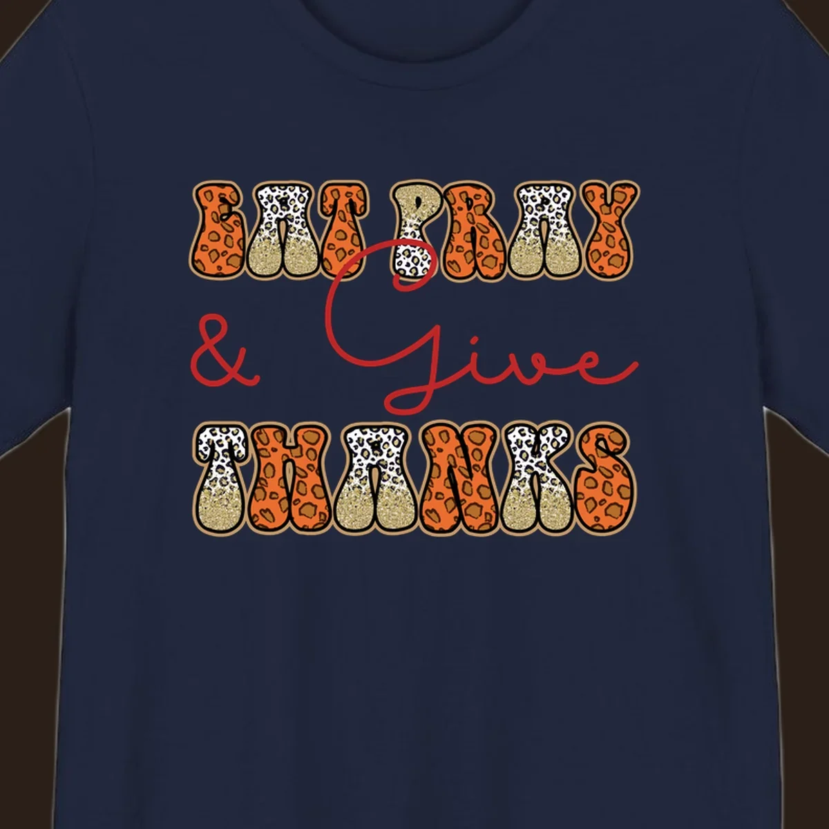 Eat Pray Give Thanks leopard print text design with gold glitter accents.