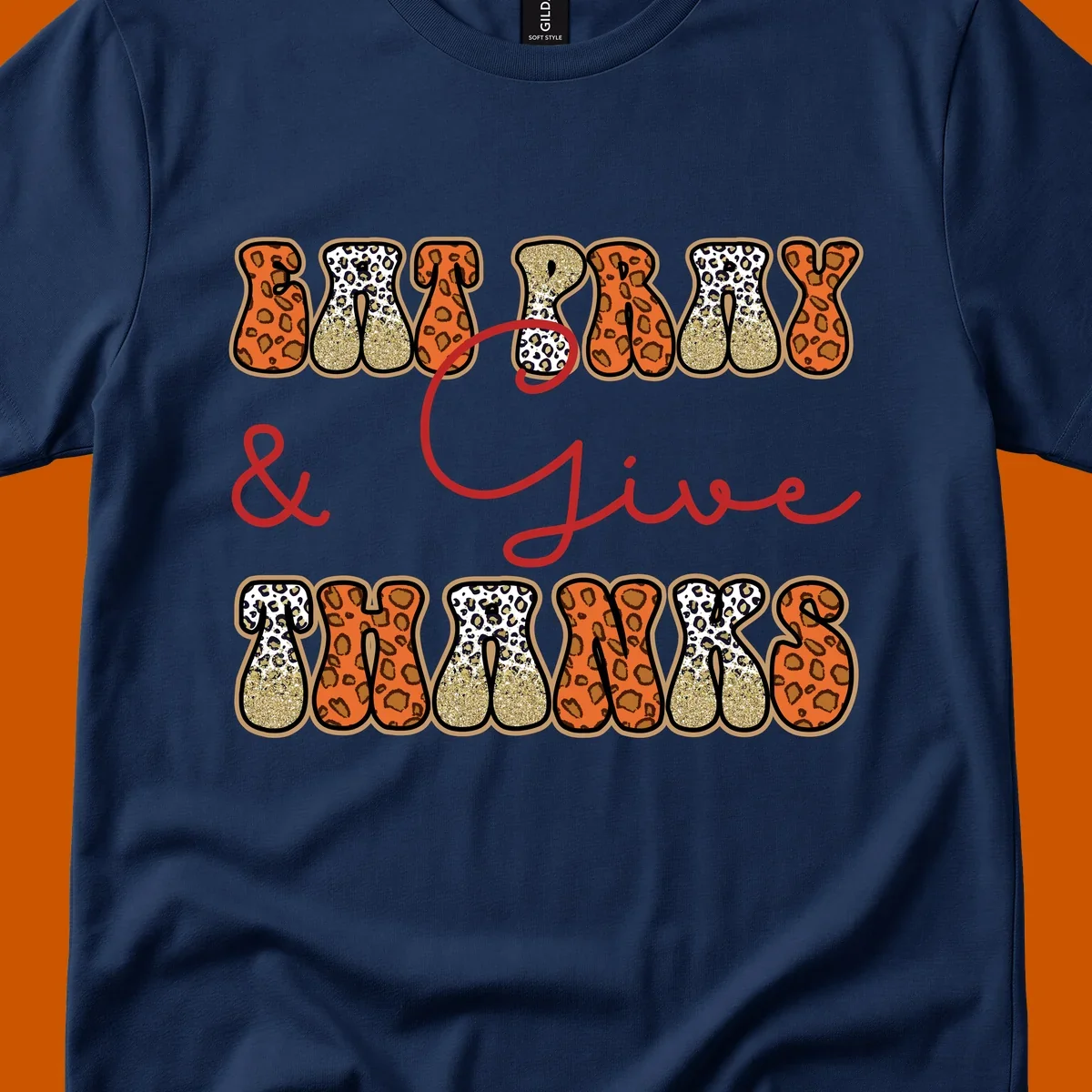 Eat Pray Give Thanks leopard print text design with gold glitter accents.