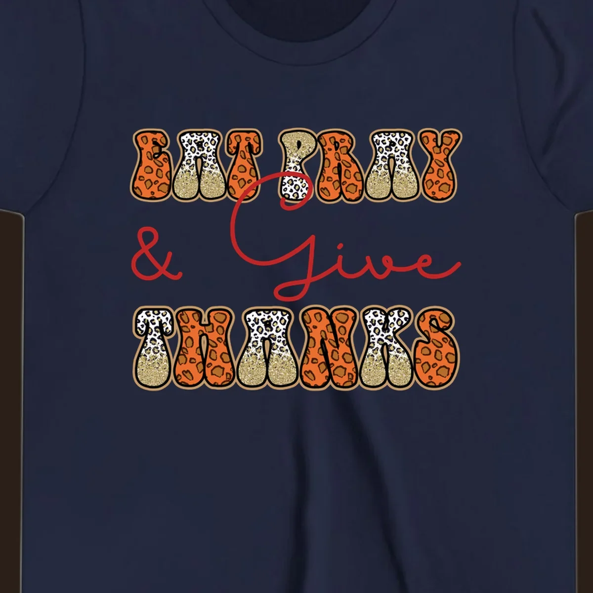 Eat Pray Give Thanks leopard print text design with gold glitter accents.