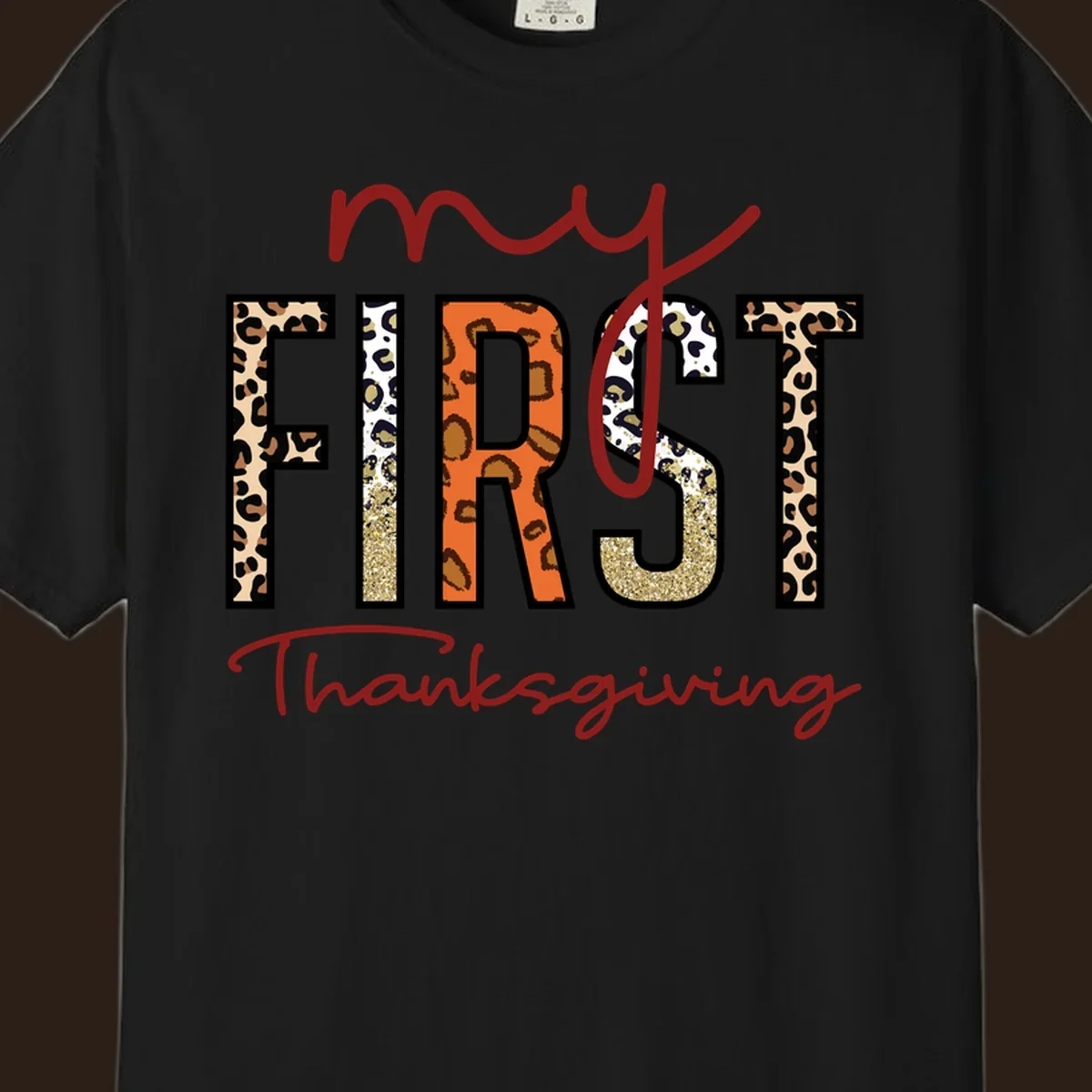 Baby's first Thanksgiving text with leopard print and glitter elements.