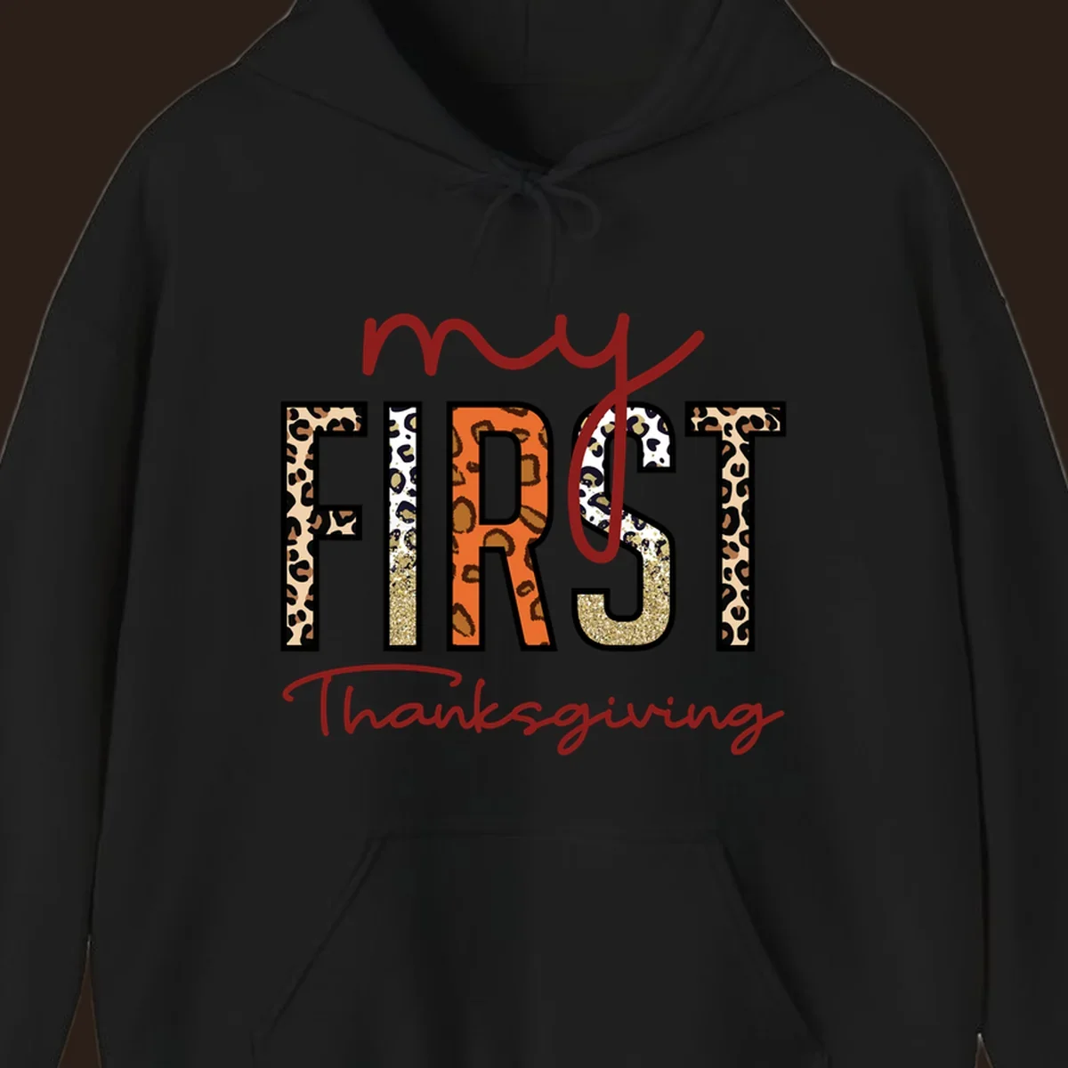 Baby's first Thanksgiving text with leopard print and glitter elements.