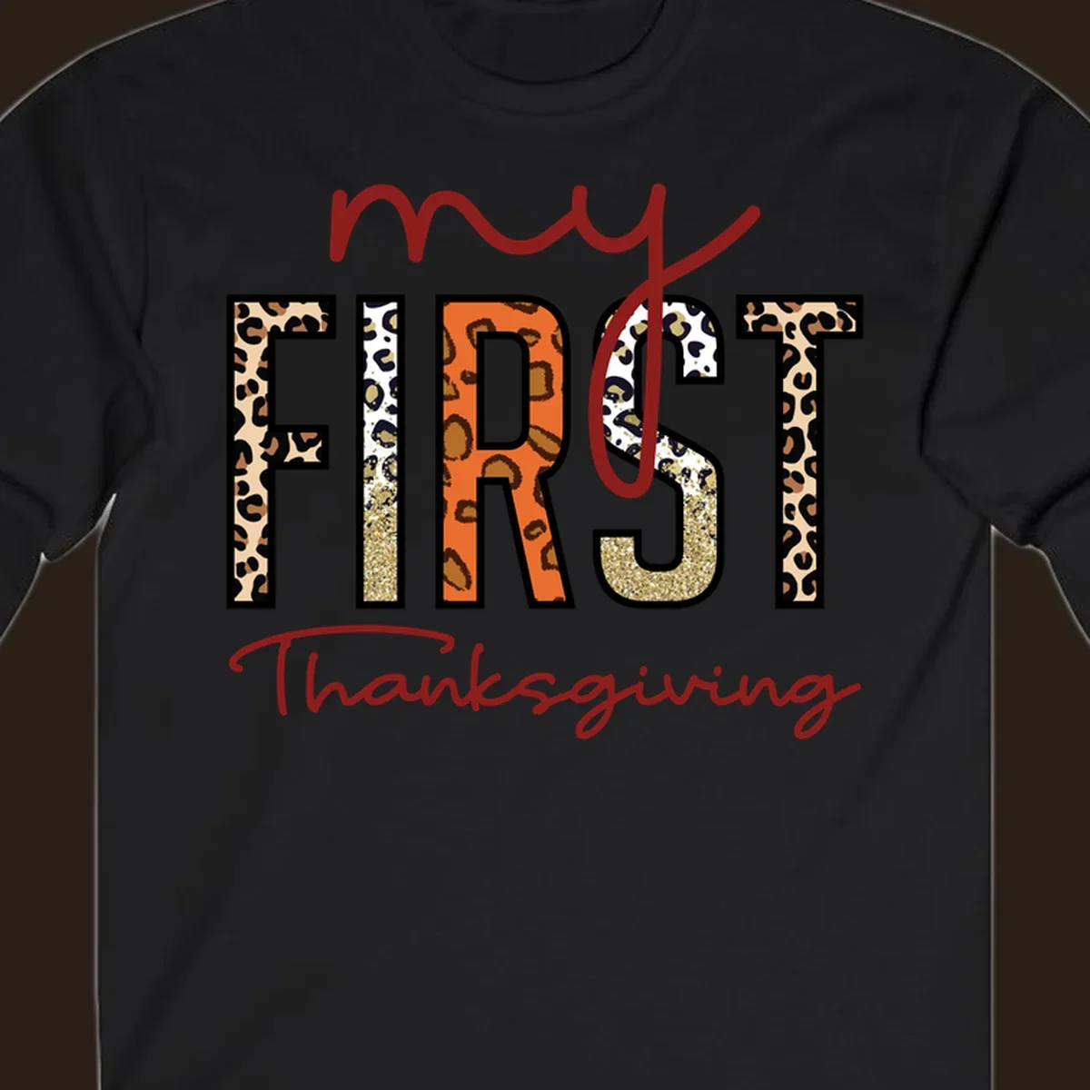 Baby's first Thanksgiving text with leopard print and glitter elements.