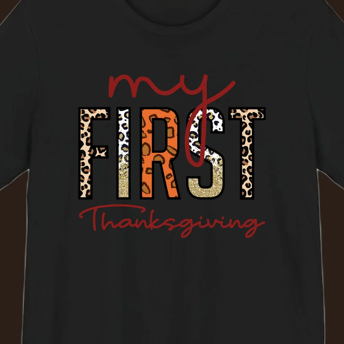 Baby's first Thanksgiving text with leopard print and glitter elements.