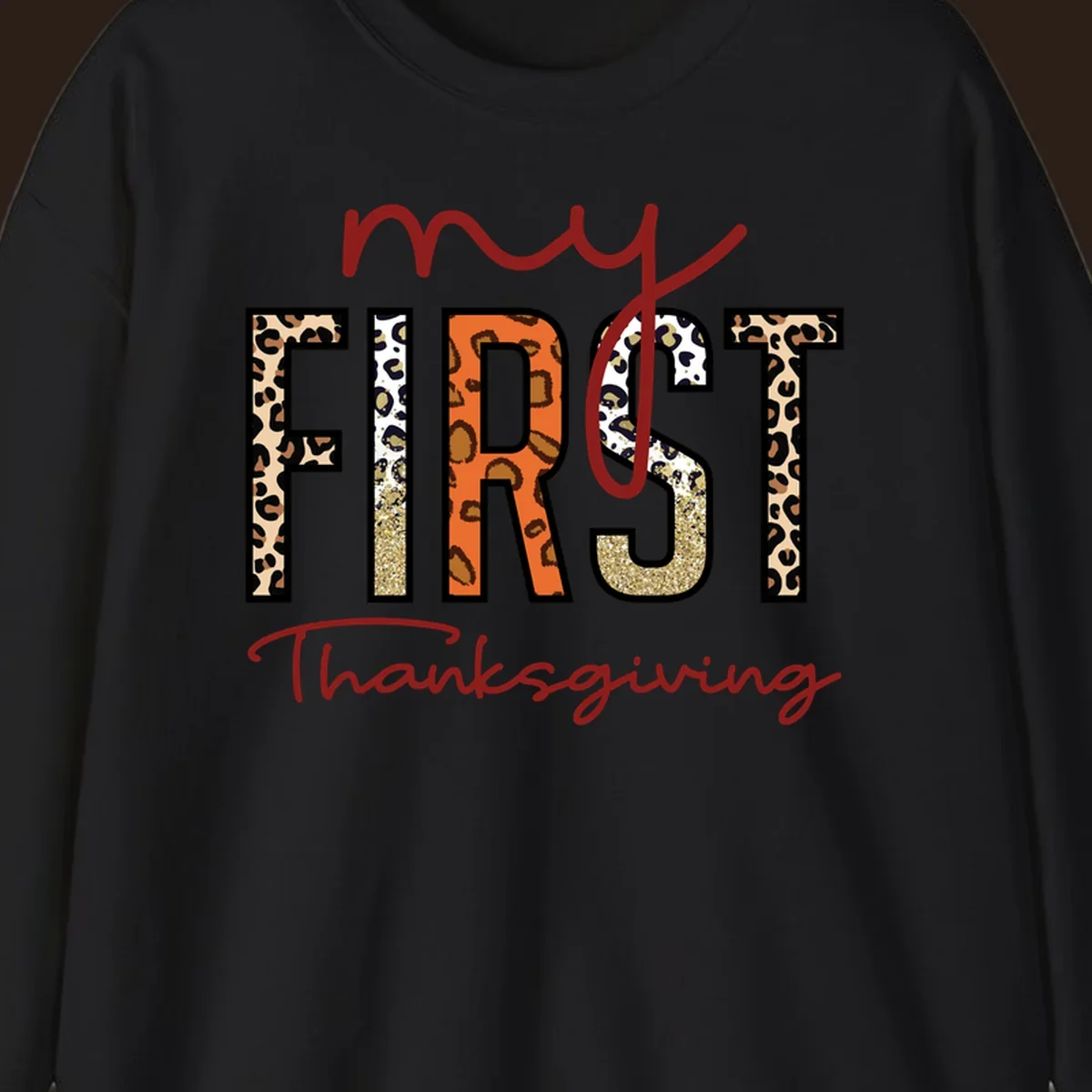 Baby's first Thanksgiving text with leopard print and glitter elements.