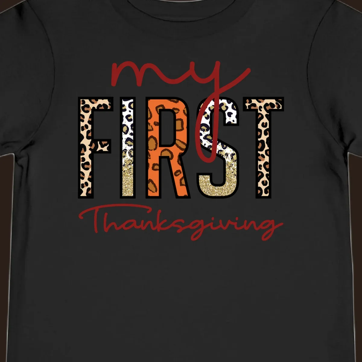 Baby's first Thanksgiving text with leopard print and glitter elements.