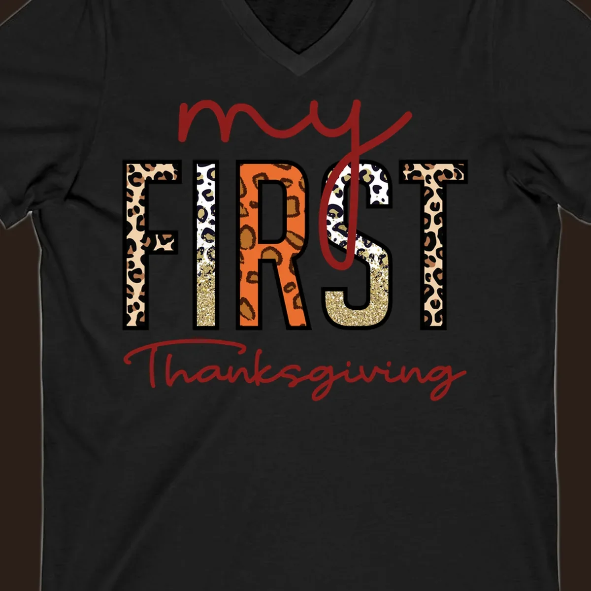Baby's first Thanksgiving text with leopard print and glitter elements.