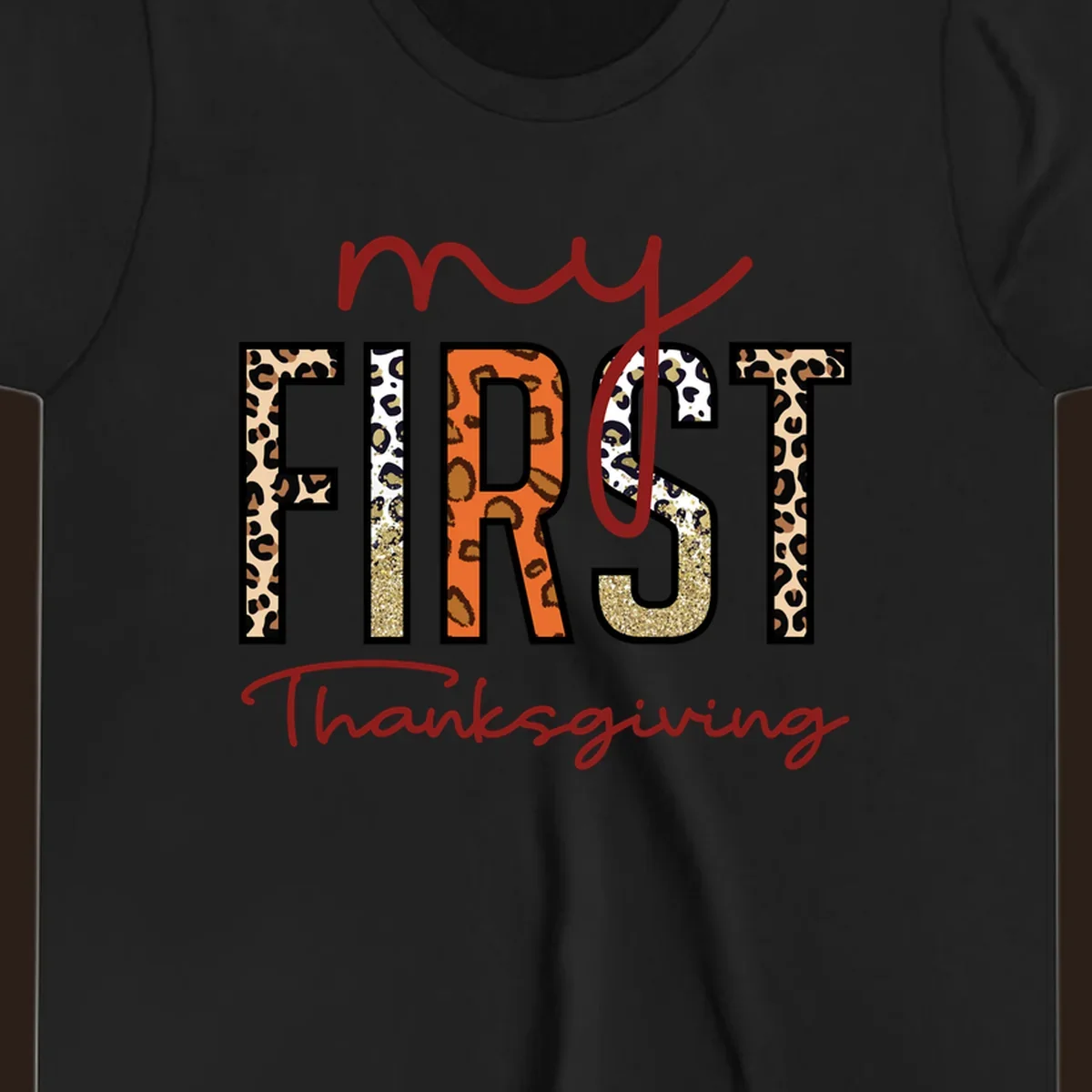 Baby's first Thanksgiving text with leopard print and glitter elements.