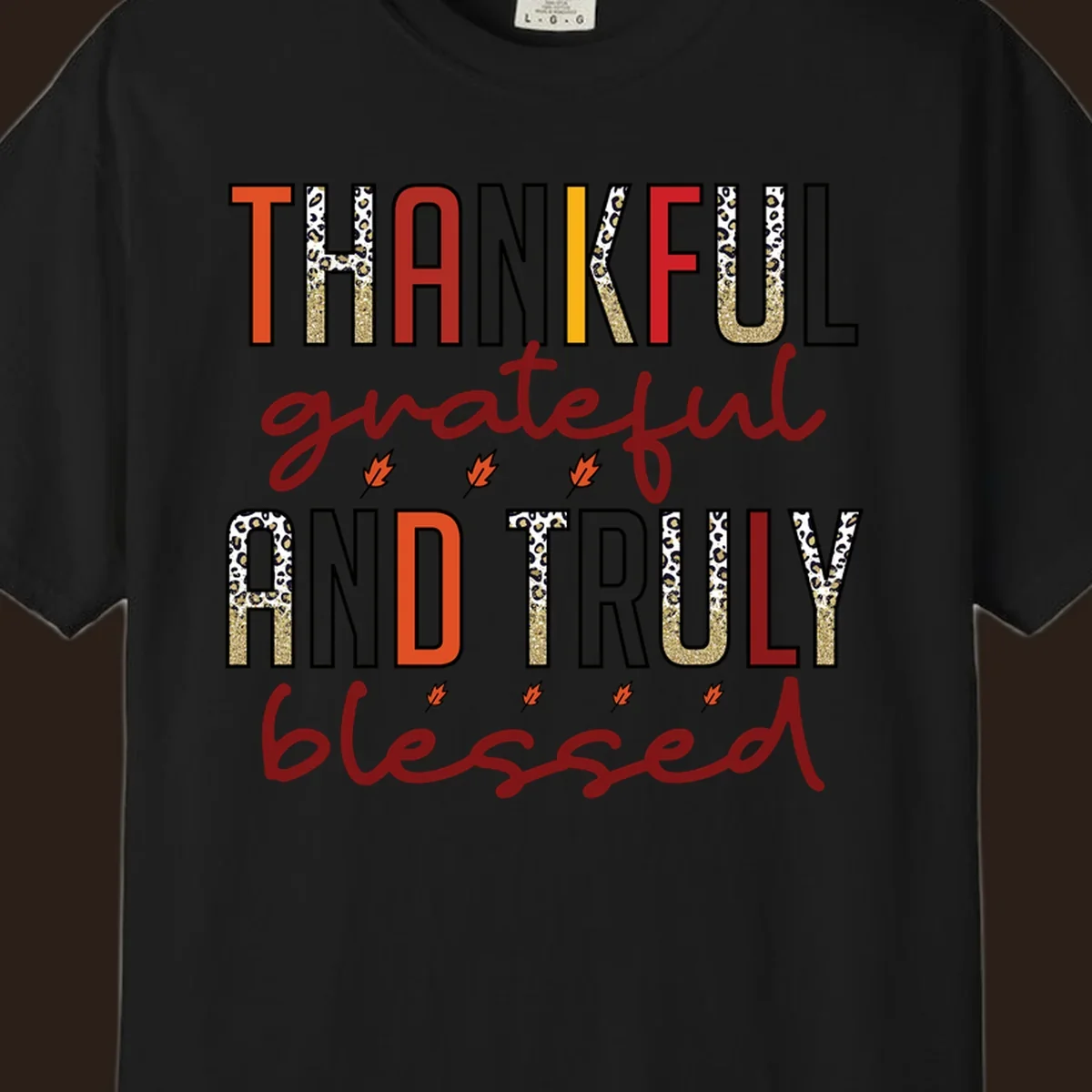 Thankful grateful and truly blessed typography with fall leaf and leopard print accents.
