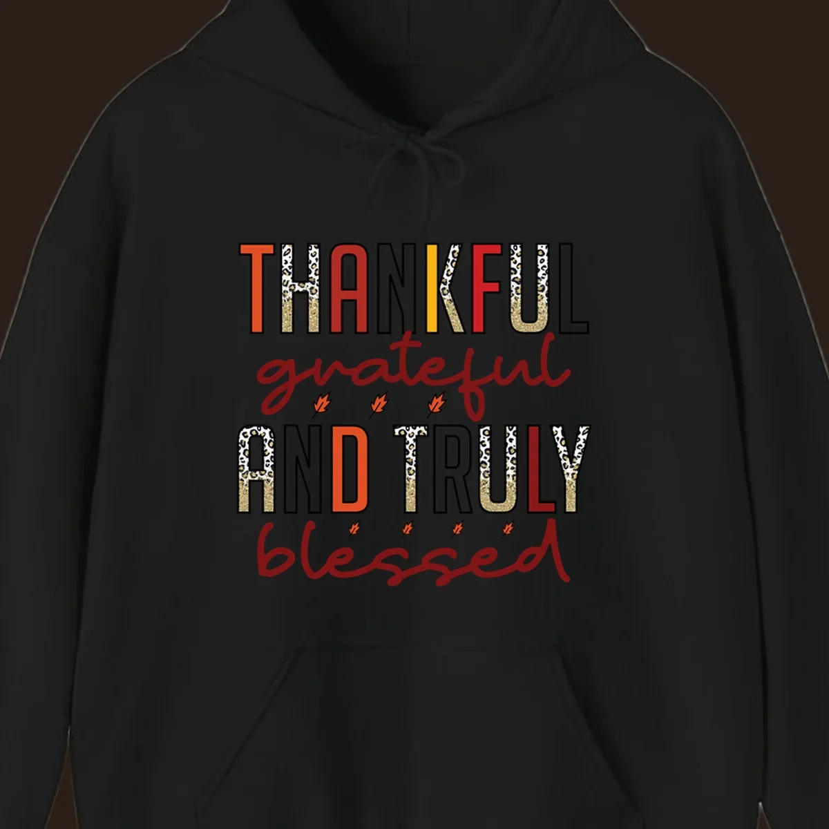 Thankful grateful and truly blessed typography with fall leaf and leopard print accents.
