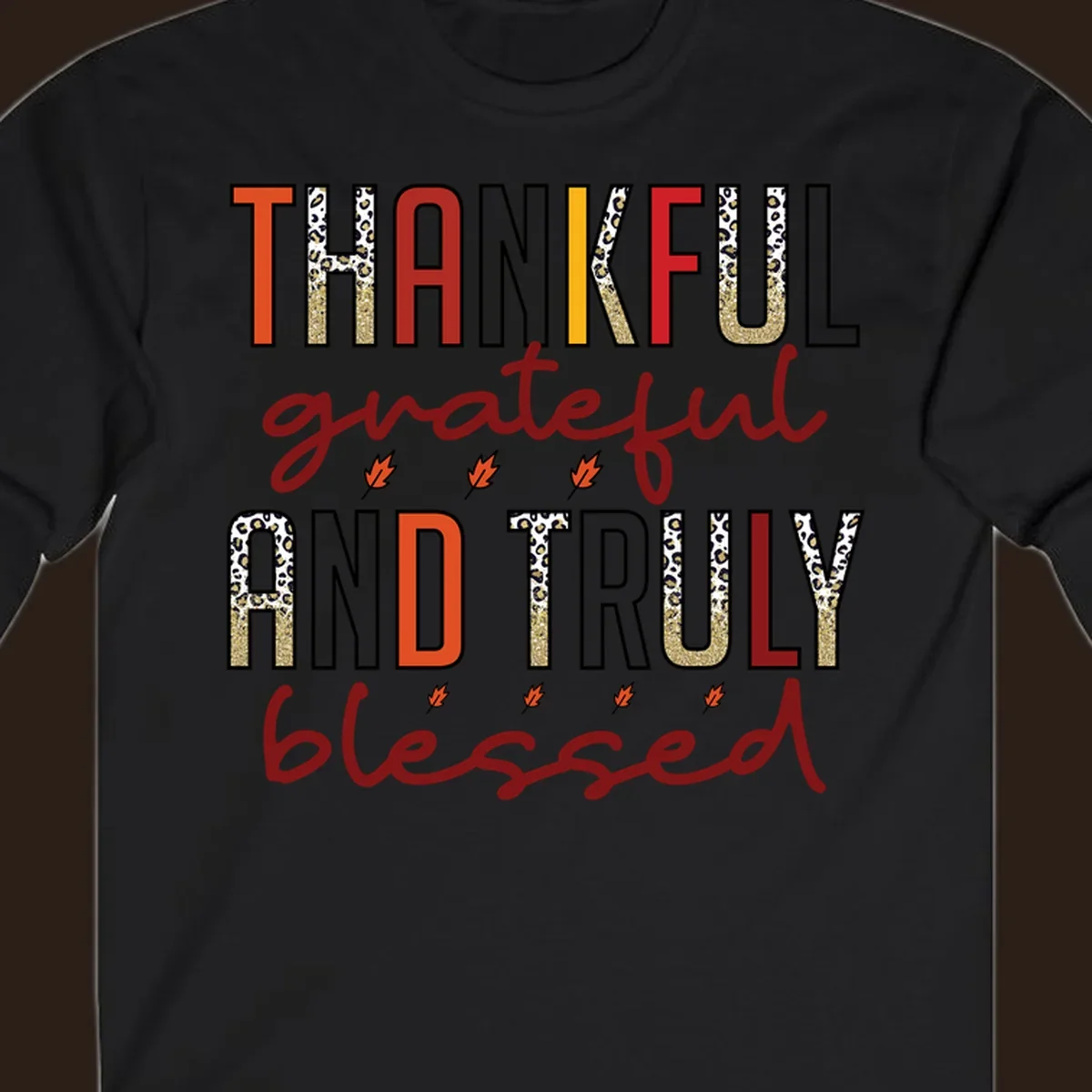 Thankful grateful and truly blessed typography with fall leaf and leopard print accents.