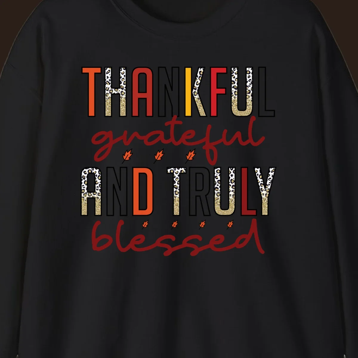 Thankful grateful and truly blessed typography with fall leaf and leopard print accents.