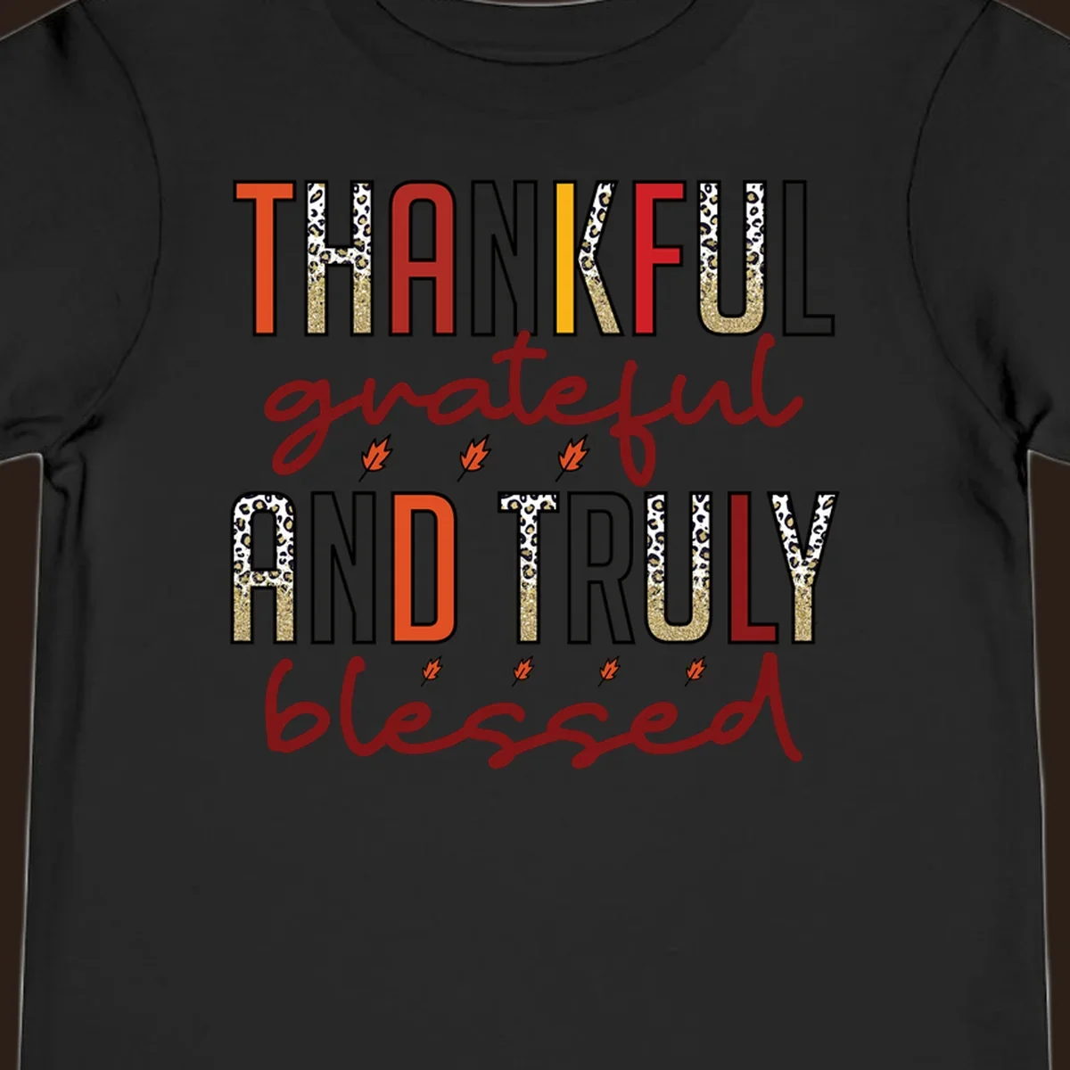 Thankful grateful and truly blessed typography with fall leaf and leopard print accents.