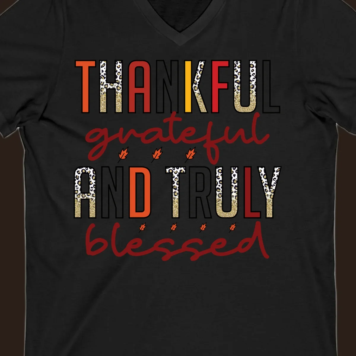 Thankful grateful and truly blessed typography with fall leaf and leopard print accents.