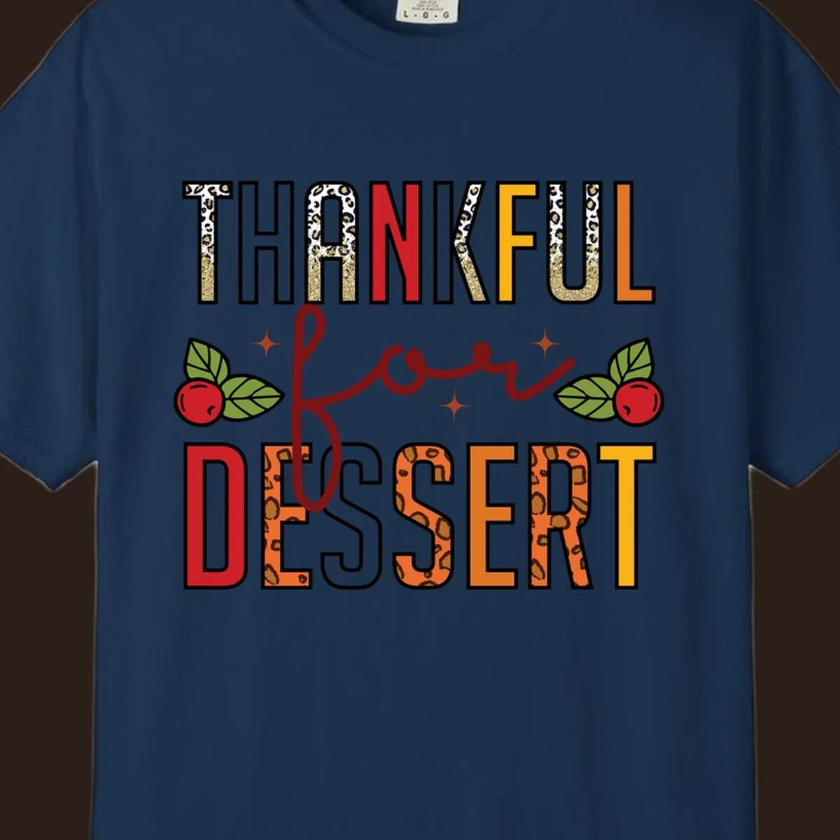 Thankful for Dessert typography with leopard print and cranberries on a dark background.