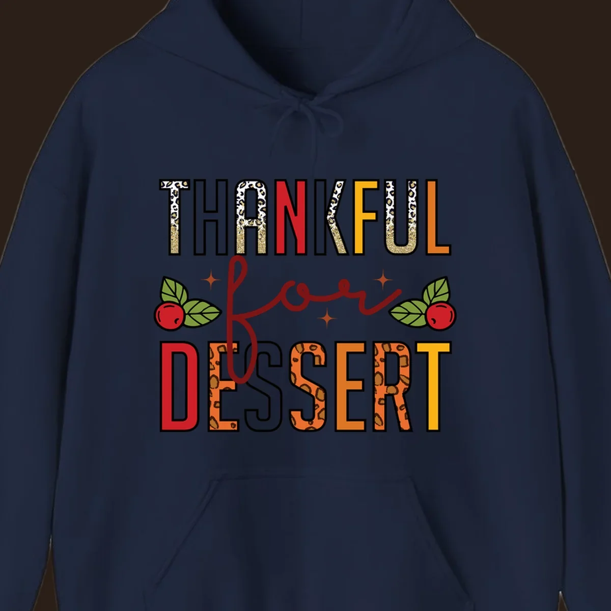 Thankful for Dessert typography with leopard print and cranberries on a dark background.