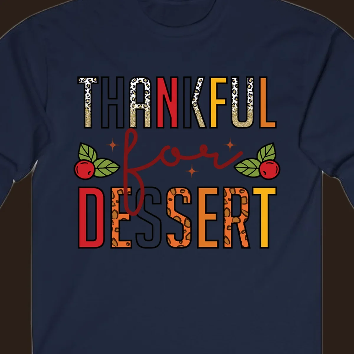 Thankful for Dessert typography with leopard print and cranberries on a dark background.