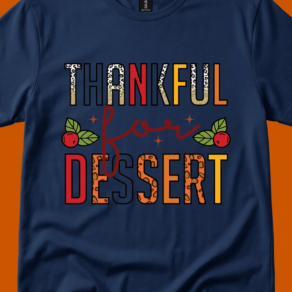 Thankful for Dessert typography with leopard print and cranberries on a dark background.
