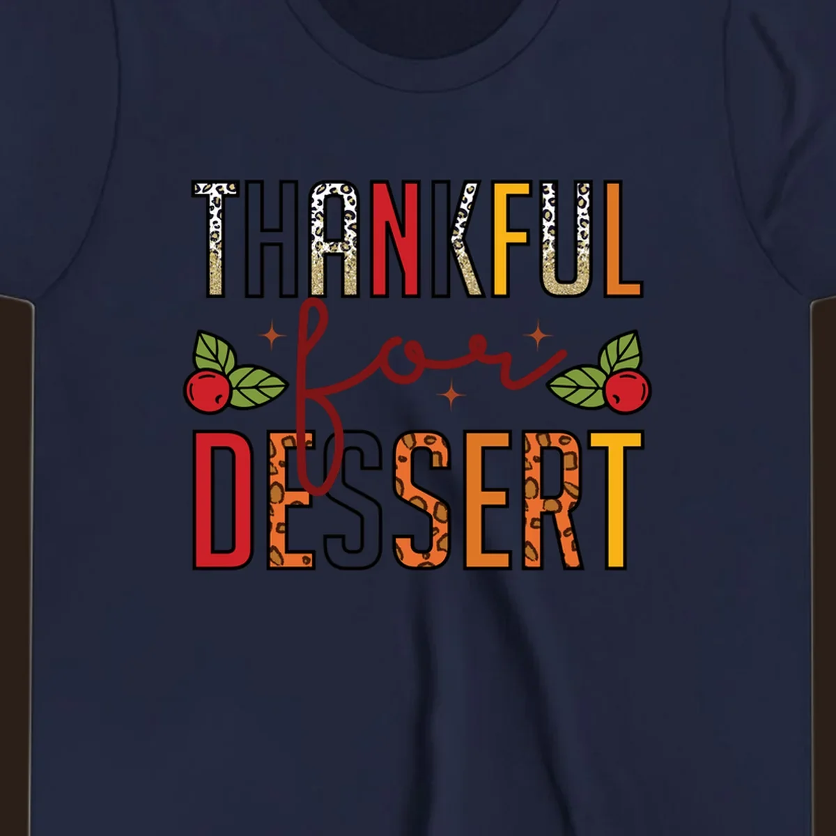 Thankful for Dessert typography with leopard print and cranberries on a dark background.
