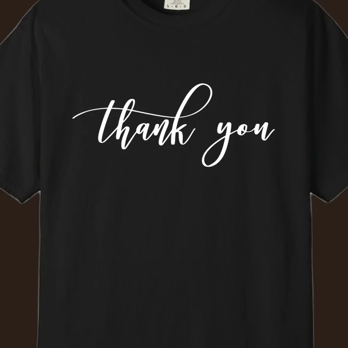 Elegant handwritten thank you script in white on a dark background.