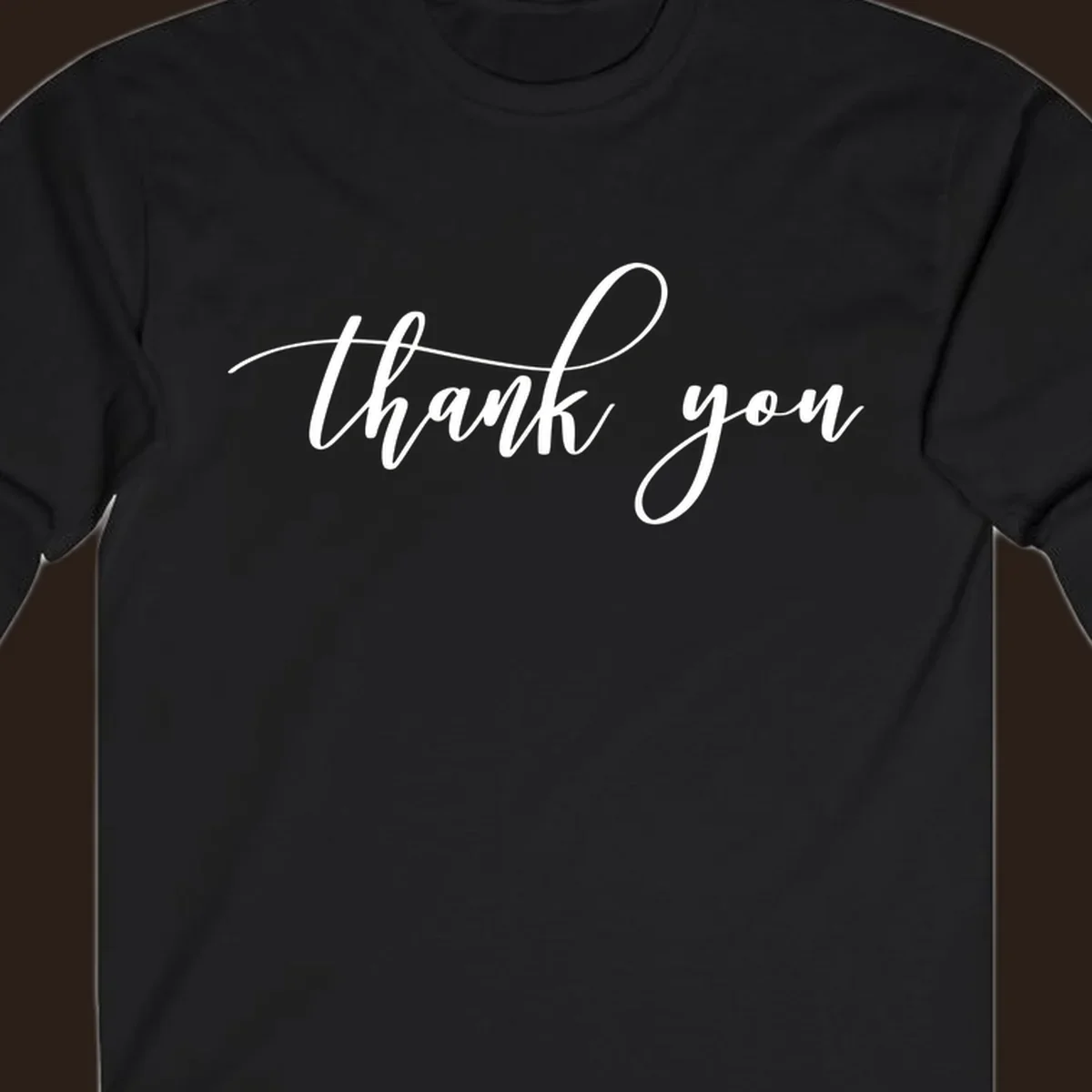 Elegant handwritten thank you script in white on a dark background.