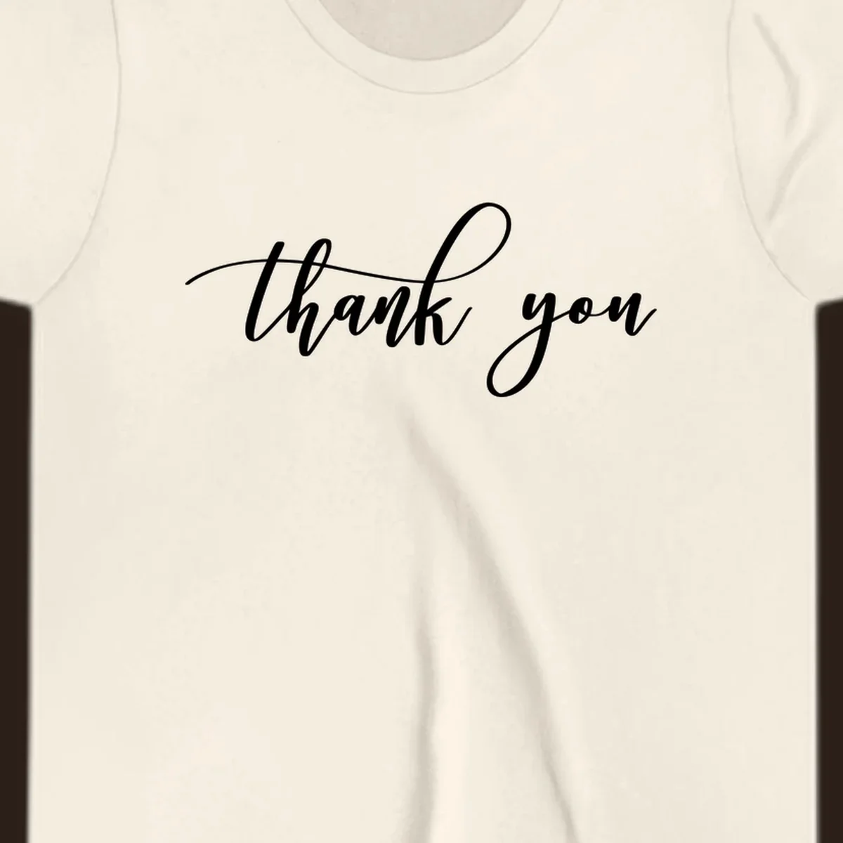 Elegant handwritten thank you script in white on a dark background.