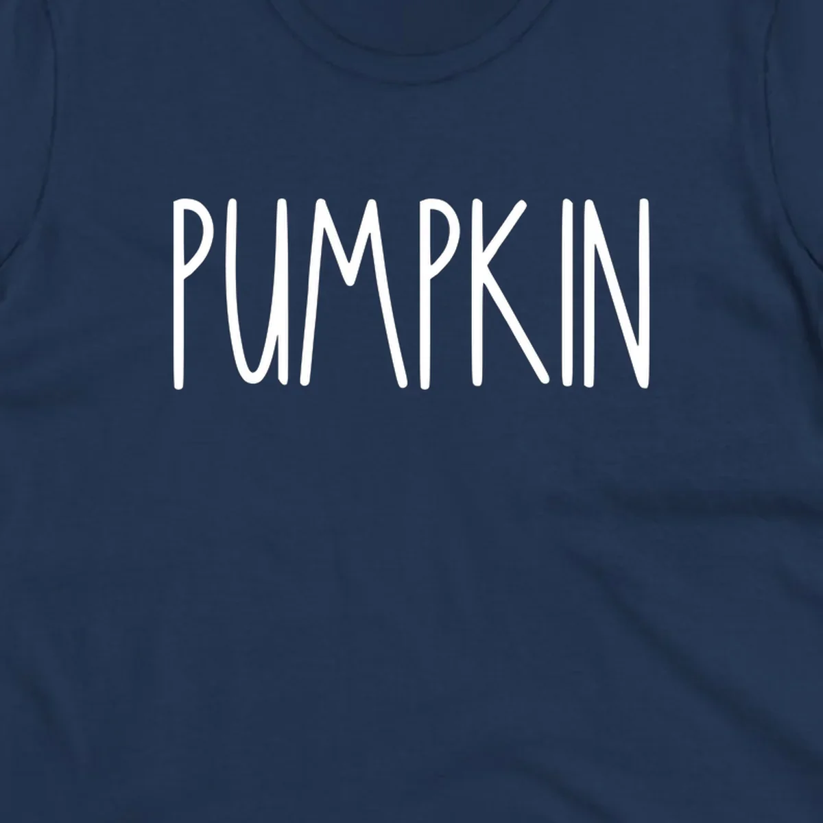 White text design that says PUMPKIN in a bold, hand-drawn font on a black background.