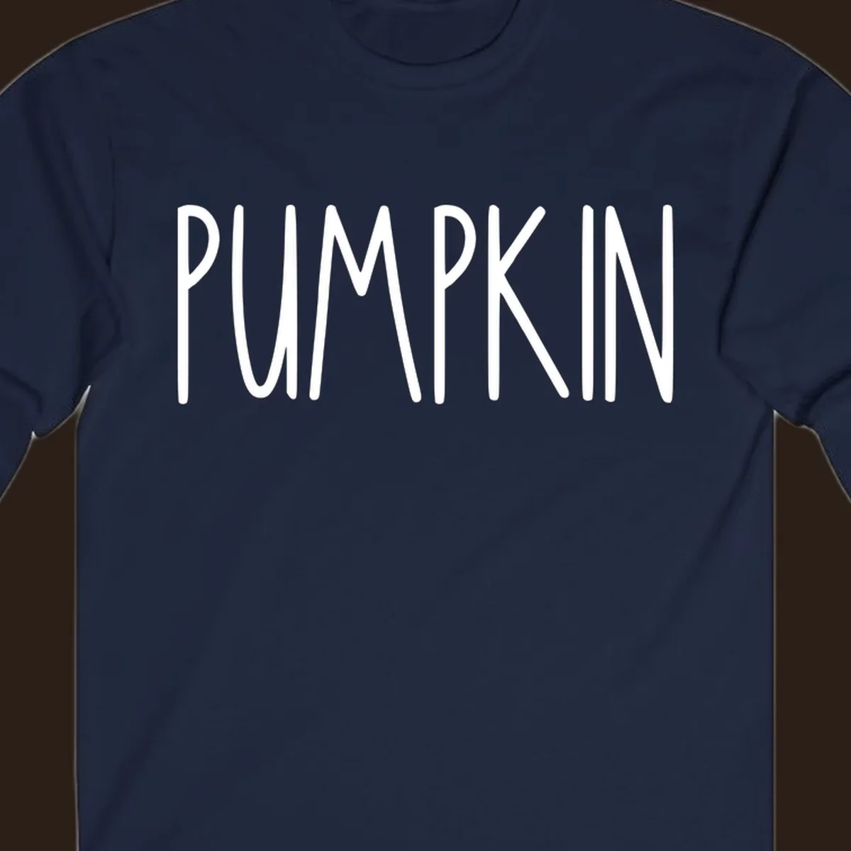 White text design that says PUMPKIN in a bold, hand-drawn font on a black background.
