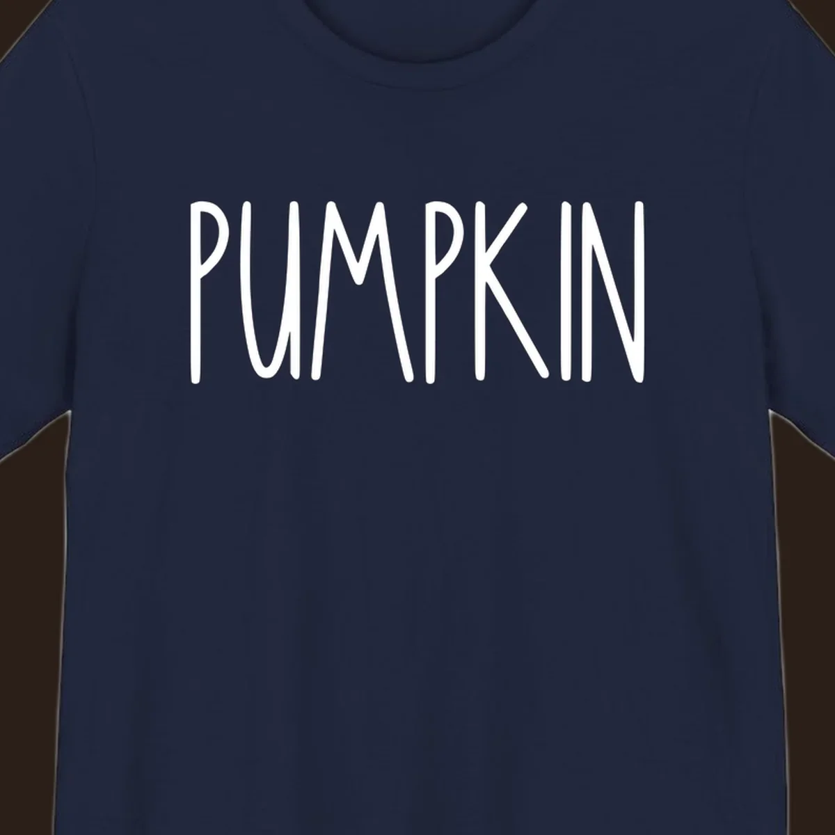 White text design that says PUMPKIN in a bold, hand-drawn font on a black background.