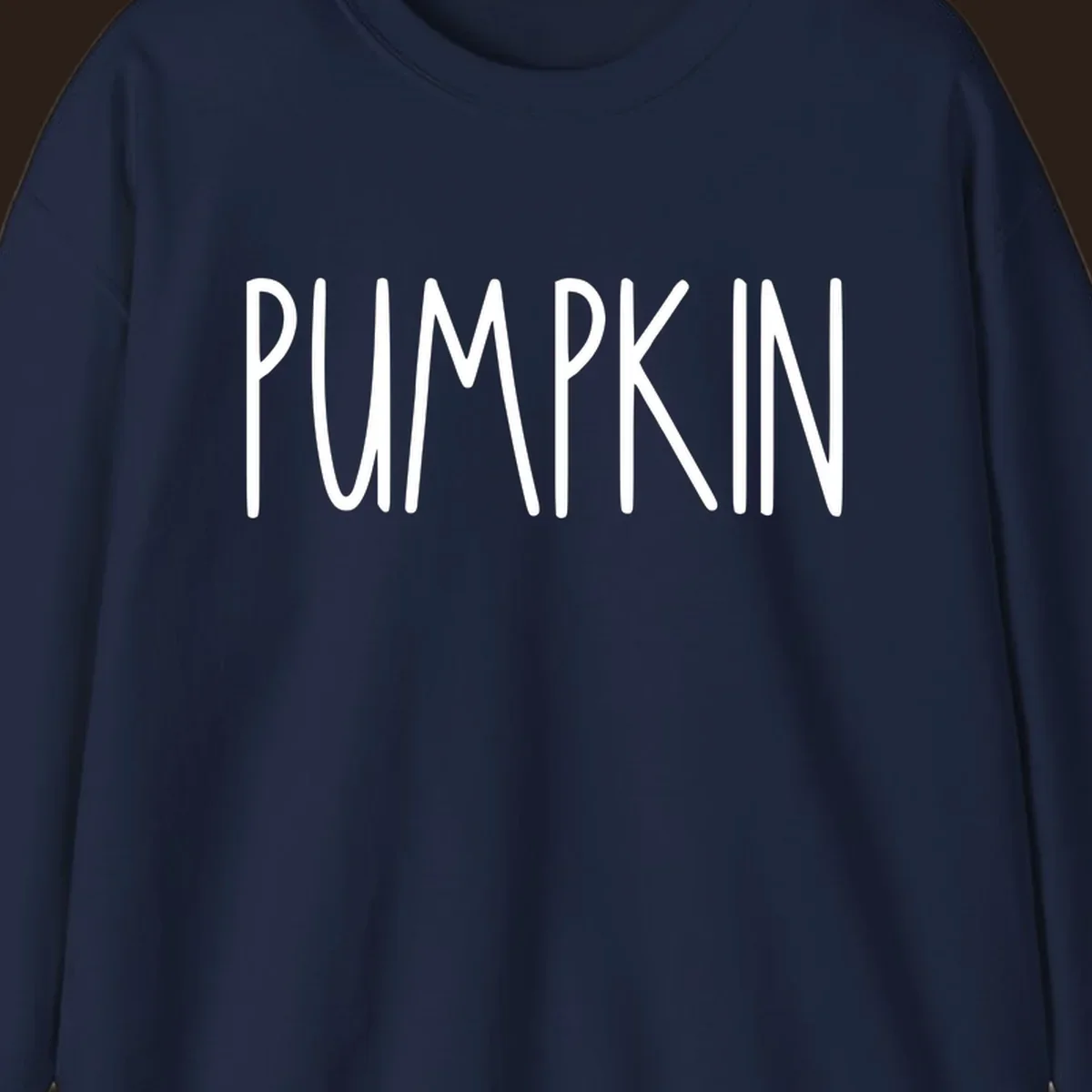 White text design that says PUMPKIN in a bold, hand-drawn font on a black background.