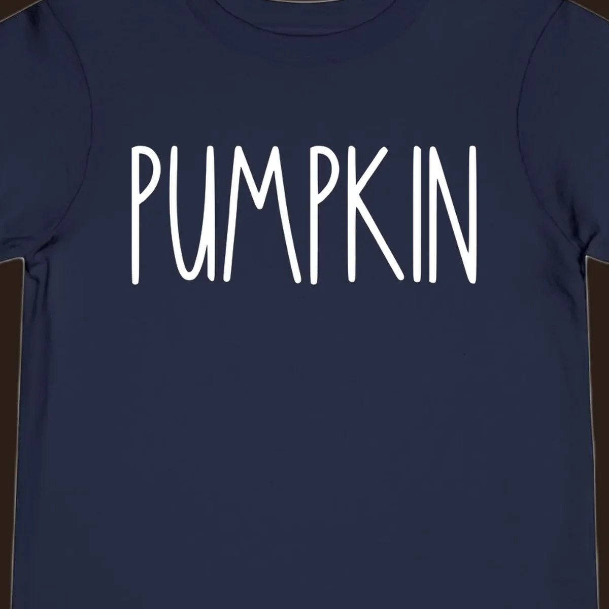 White text design that says PUMPKIN in a bold, hand-drawn font on a black background.